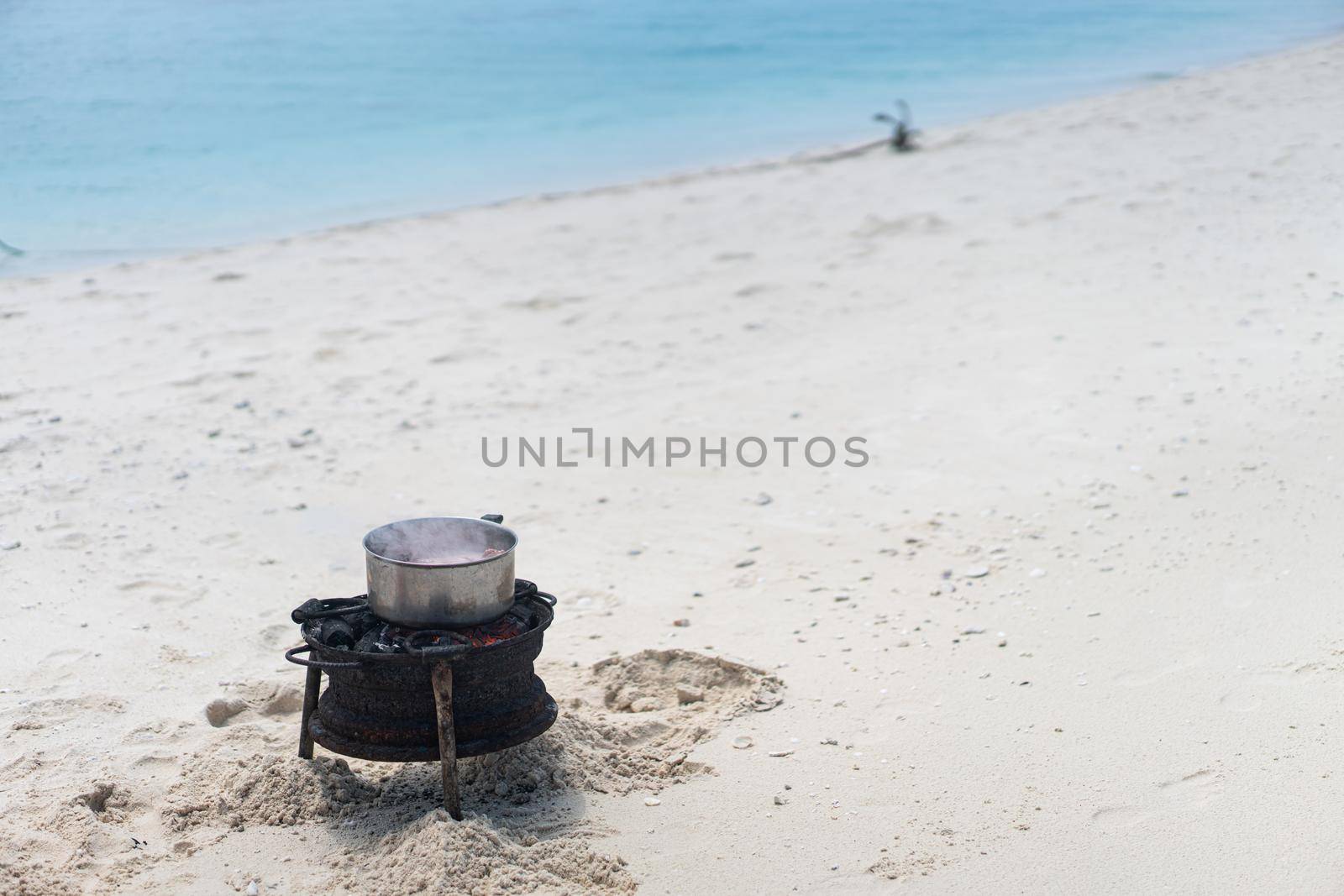 Having joy on beach sand making the food