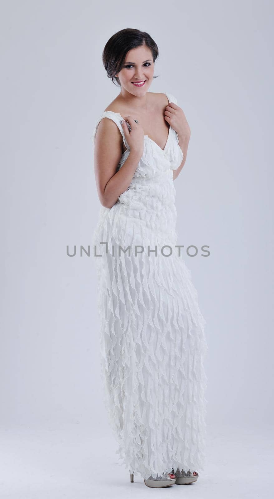 beautiful young bride wearing  wedding dress in retro fashion style isolated on white background in studio