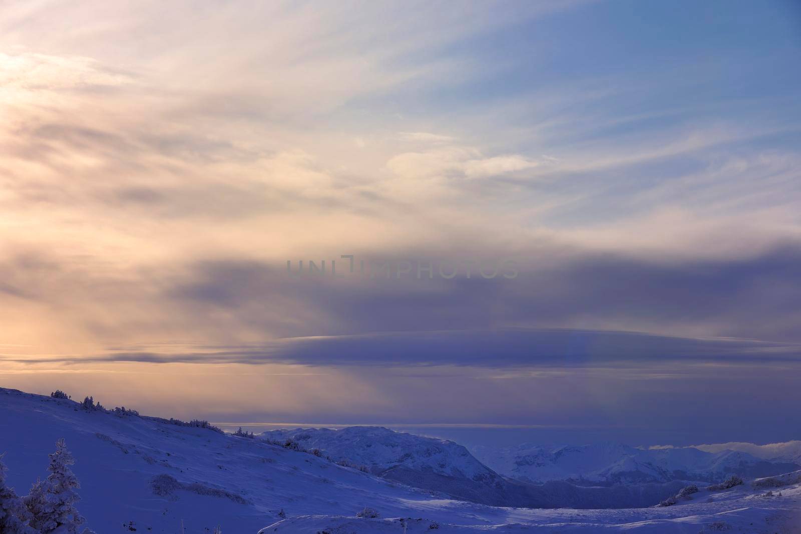 winter mountain landscape at sunny day and snow peaks