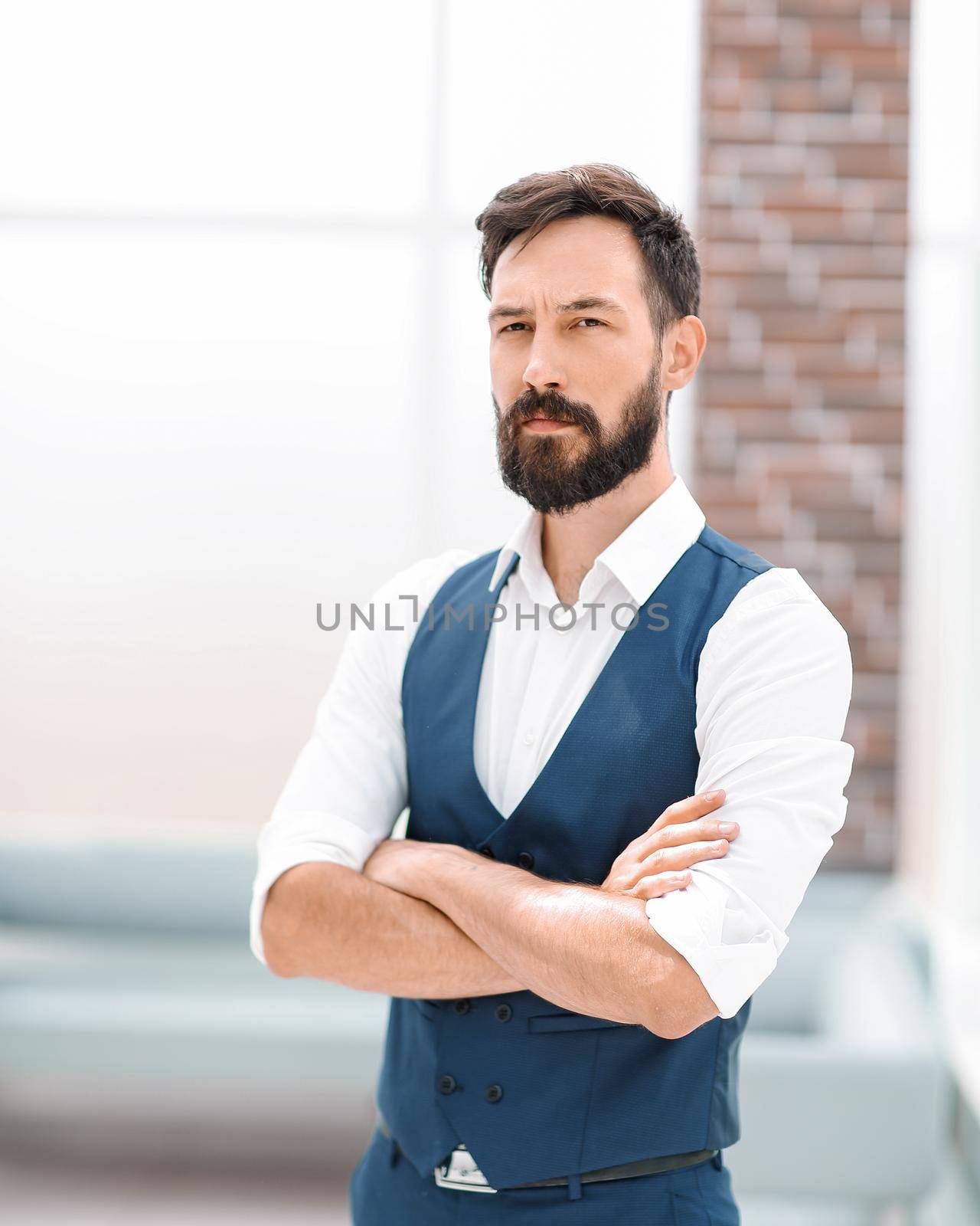 serious businessman standing in a modern office.business people
