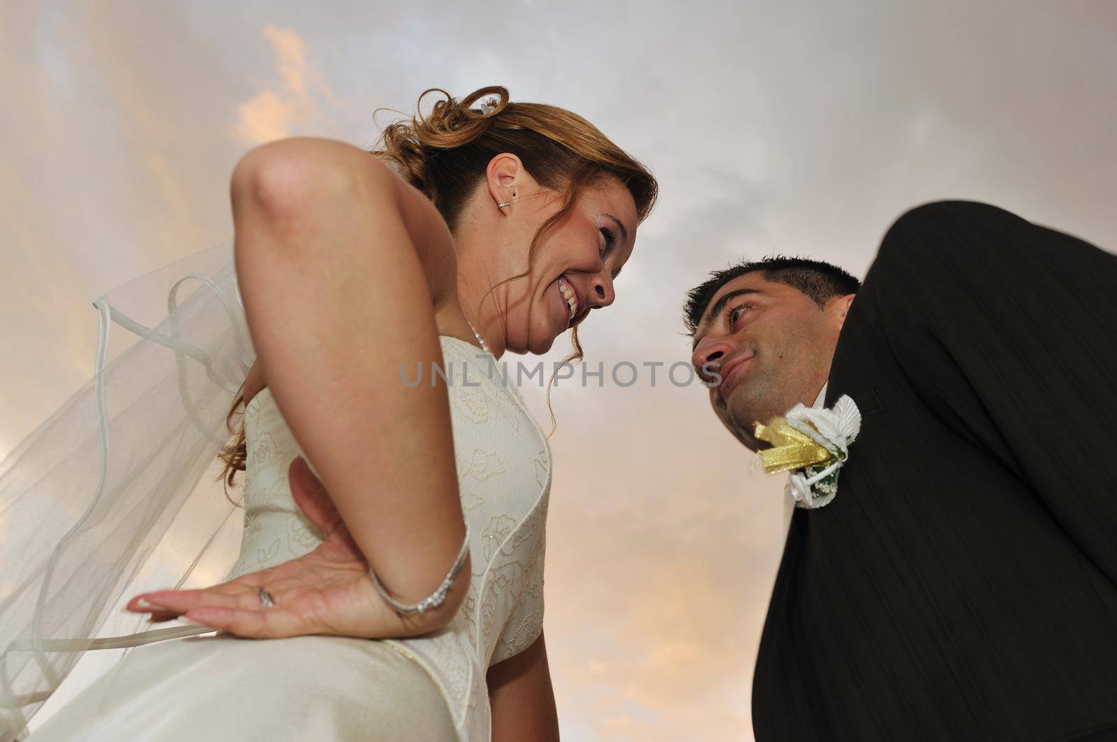 happy young and beautiful bride and groom at wedding party  outdoor