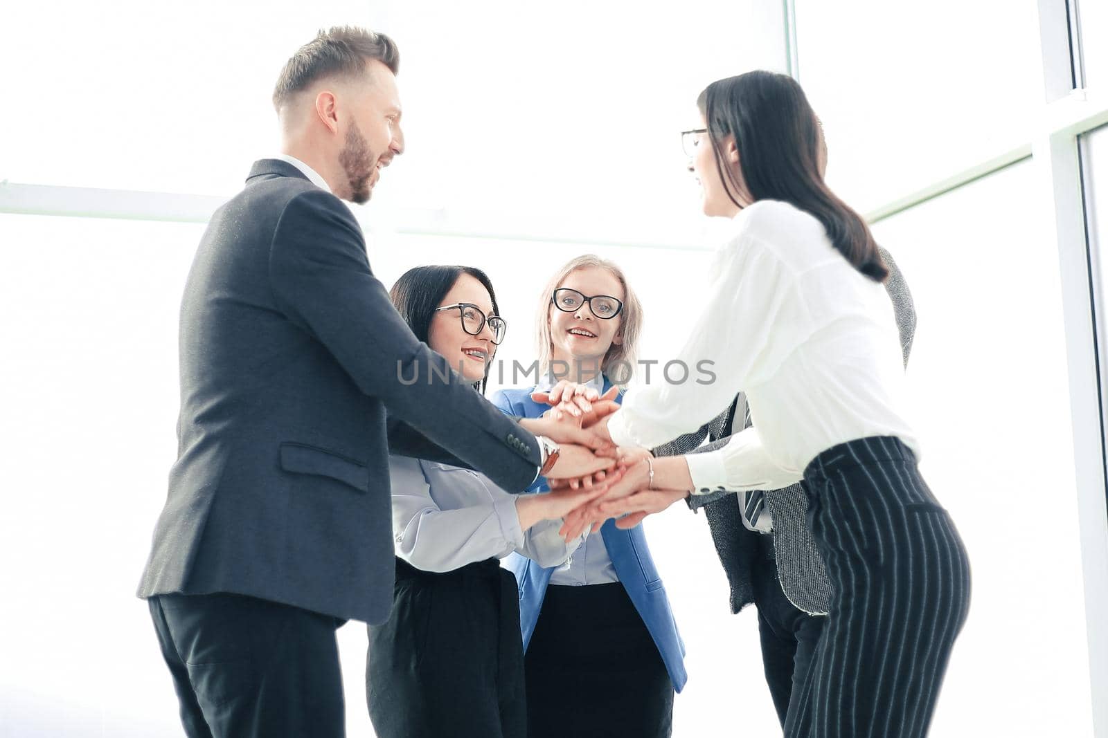 professional business team putting their hands together. the concept of successful teamwork