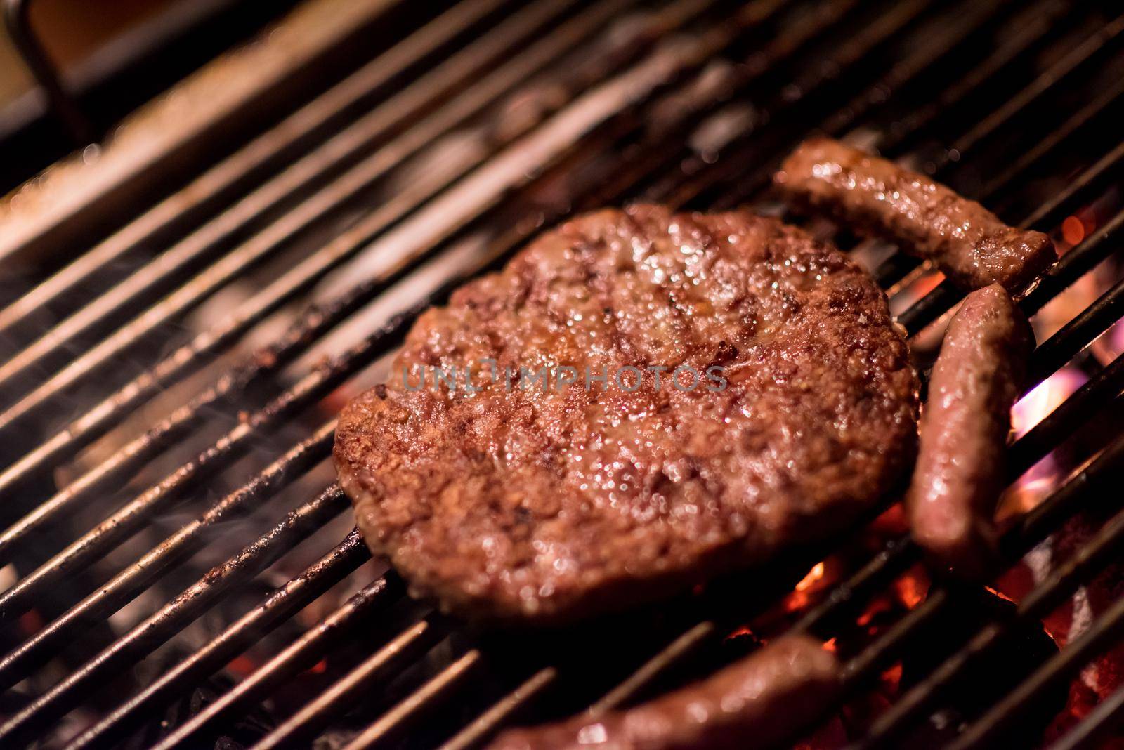 Assorted delicious grilled meat over the coals on barbecue