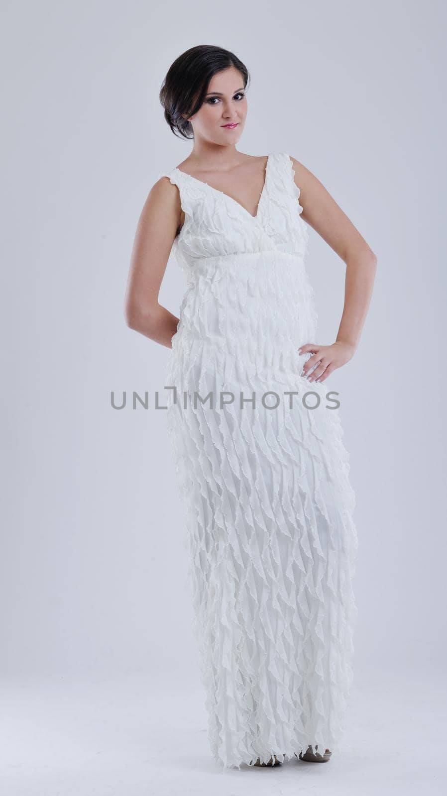 beautiful young bride wearing  wedding dress in retro fashion style isolated on white background in studio