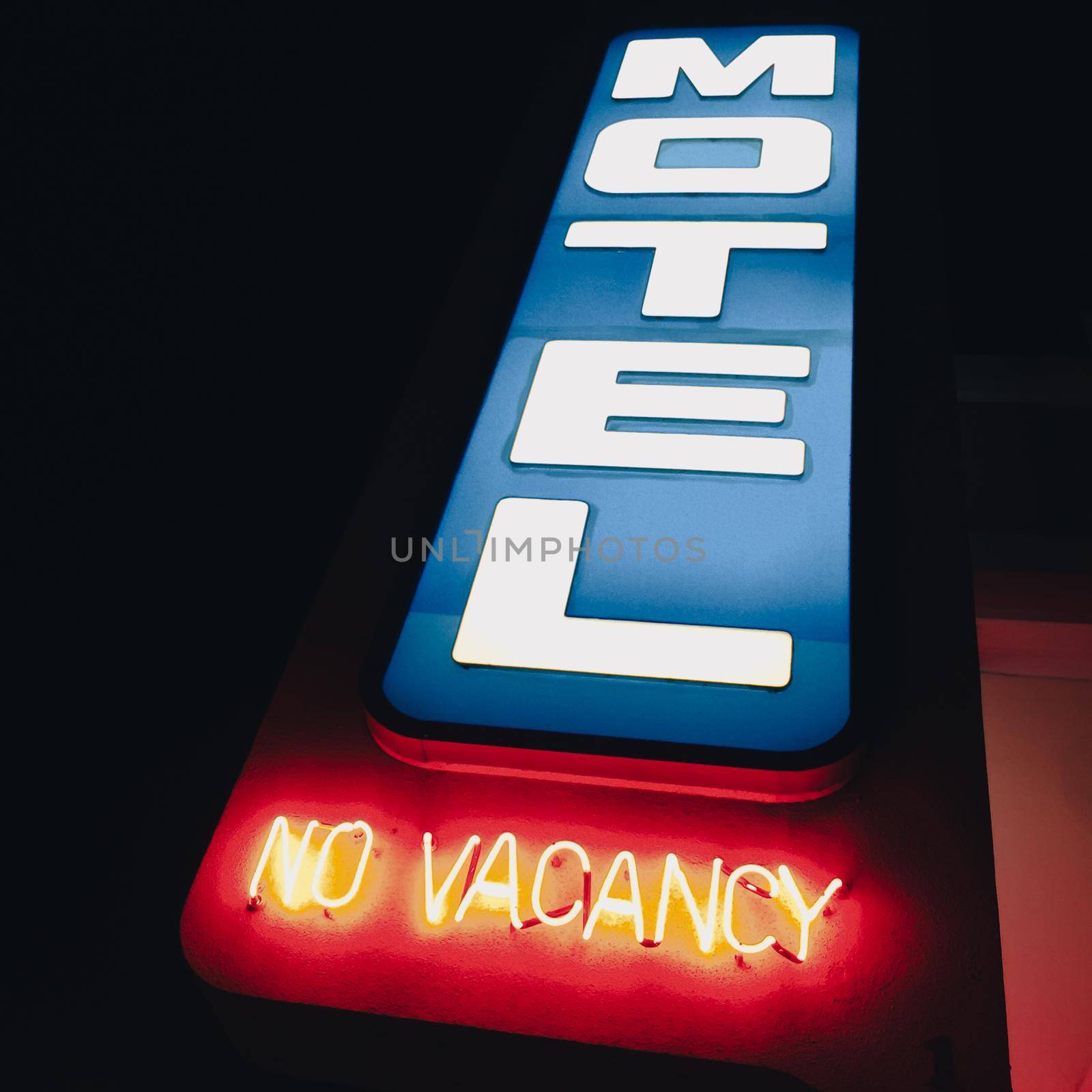 neon motel sign in usa, no vacany highlighted in red