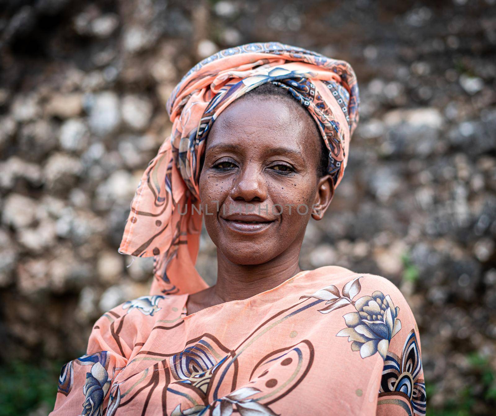 Black African senior beautiful woman with scarf outdoors