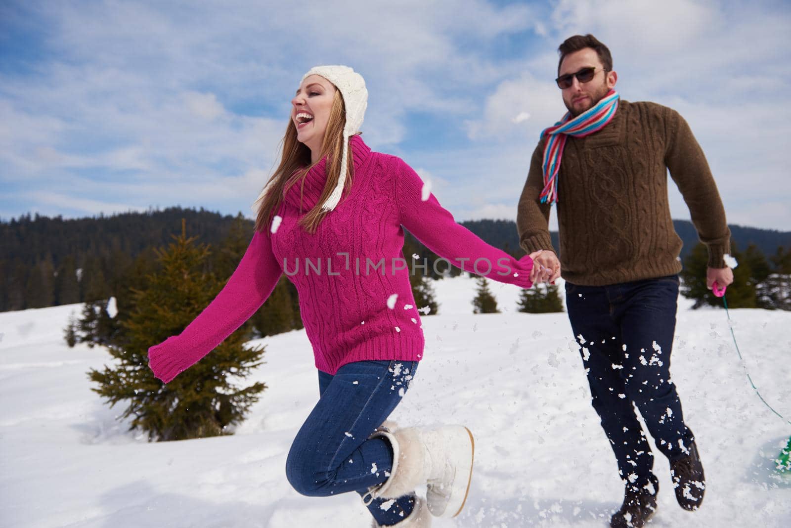 romantic winter  scene, happy young couple having fun on fresh show on winter vacatio, mountain nature landscape