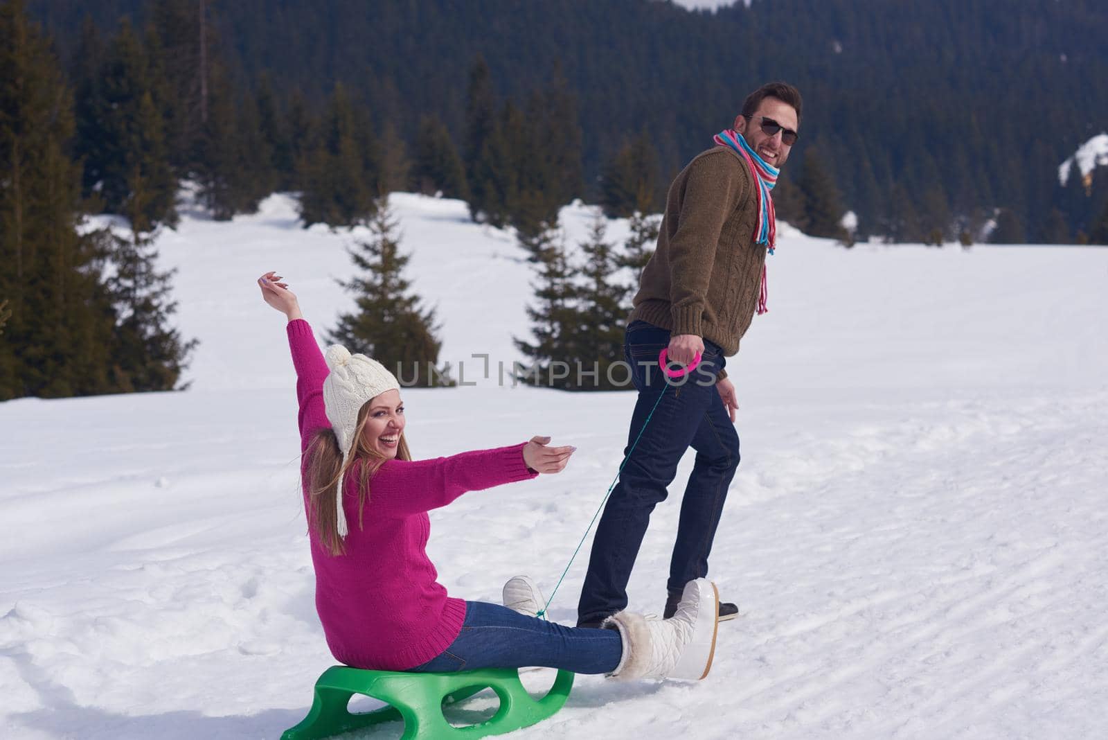 romantic winter  scene, happy young couple having fun on fresh show on winter vacatio, mountain nature landscape