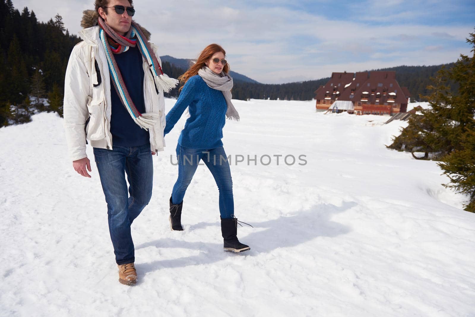 romantic winter  scene, happy young couple having fun on fresh show on winter vacatio, mountain nature landscape