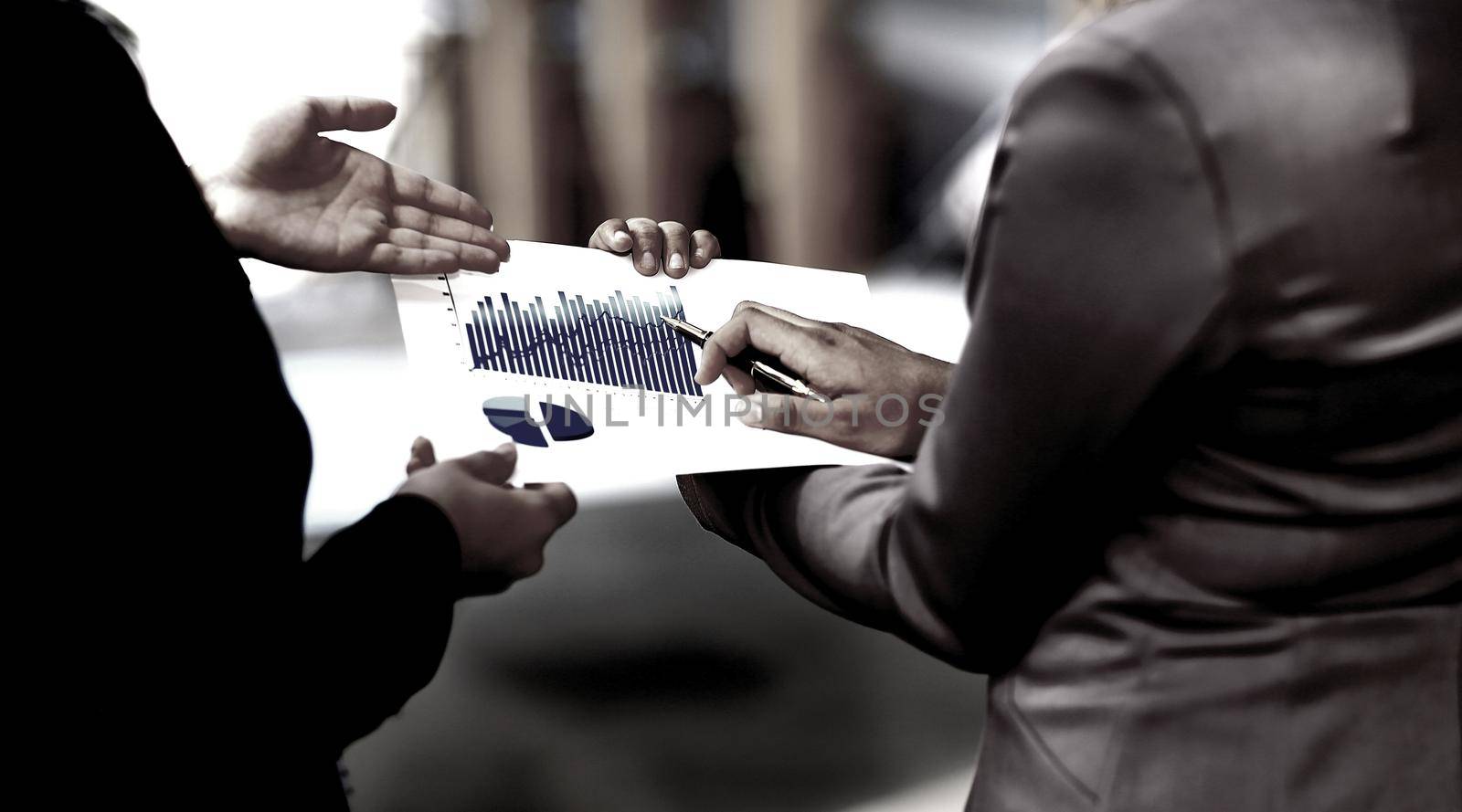 close up. managers discussing the financial profit of the company.