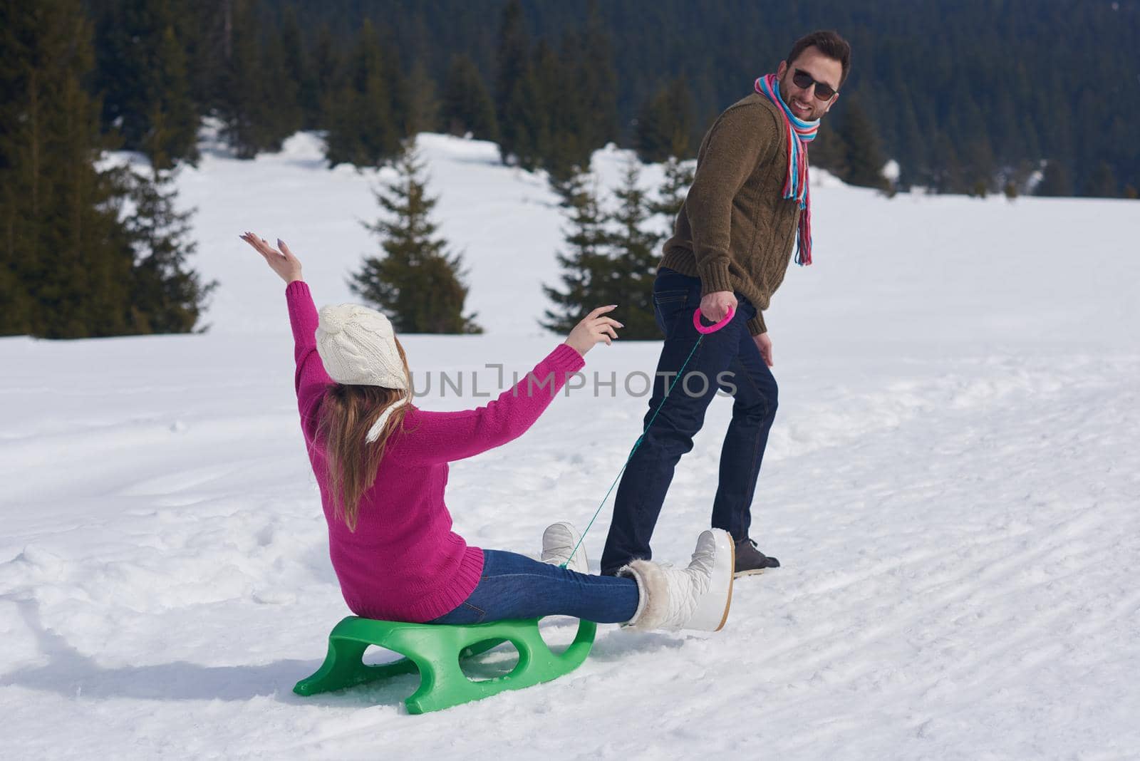 romantic winter  scene, happy young couple having fun on fresh show on winter vacatio, mountain nature landscape