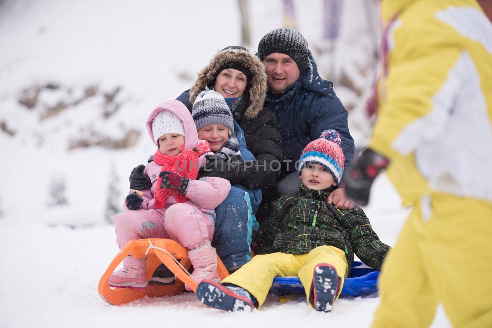 children group  having fun and play together in fresh snow by dotshock