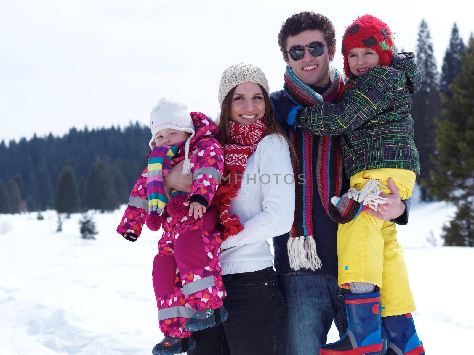 Winter playing, fun, snow and family portrait  sledding at winter time