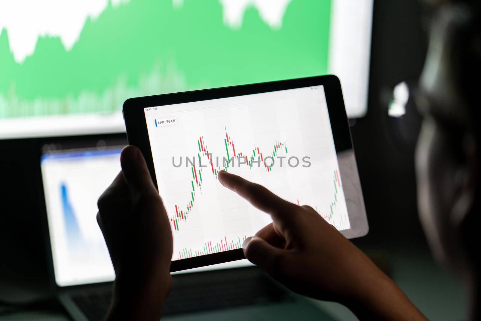 Crypto trader investor analyst looking at computer screen analyzing financial graph data on pc monitor, thinking of online stock exchange market .