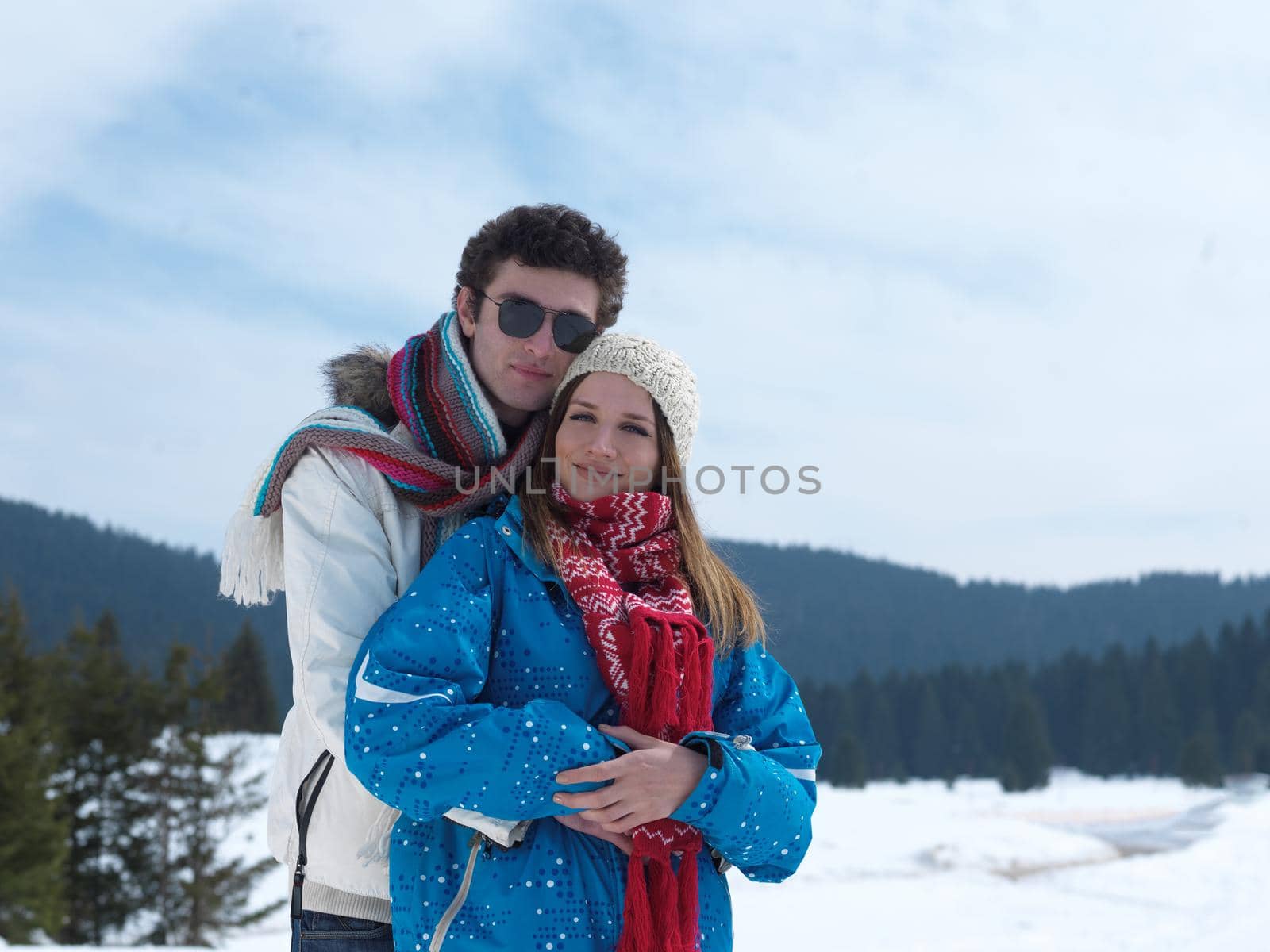 portrait of happy young romantic tourist  couple outdoor in nature at winter vacation