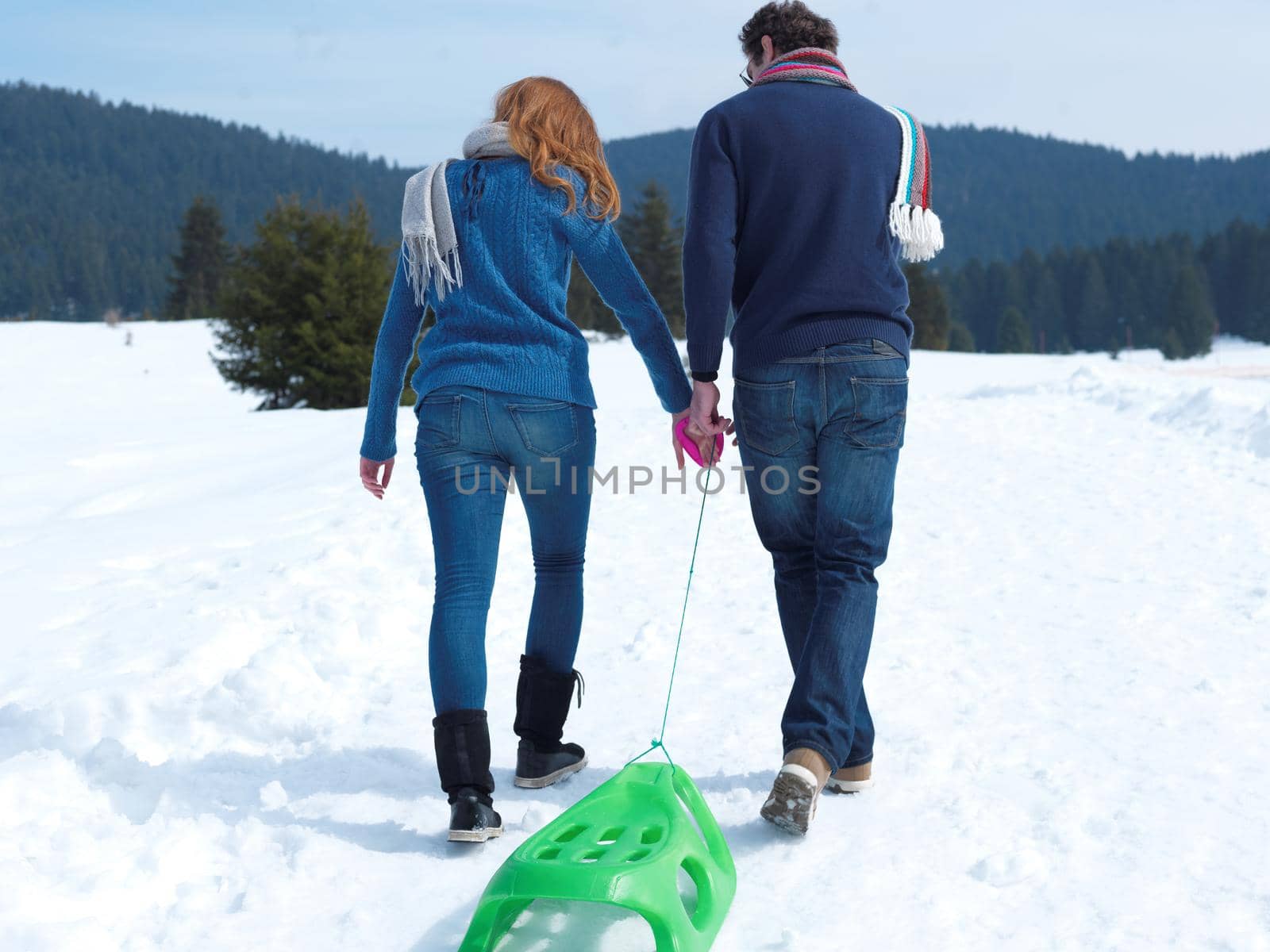 happy young couple having fun on fresh show on winter vacation by dotshock