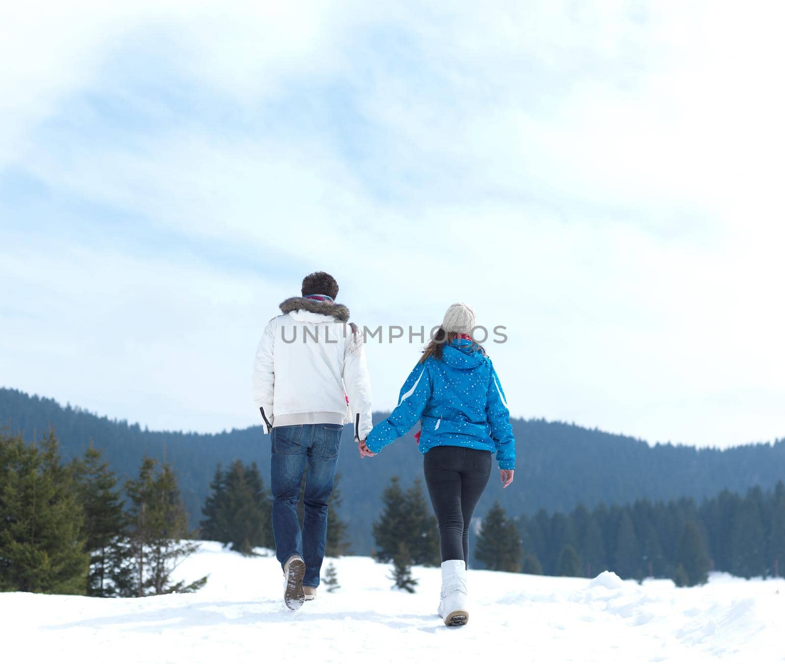 portrait of happy young romantic tourist  couple outdoor in nature at winter vacation