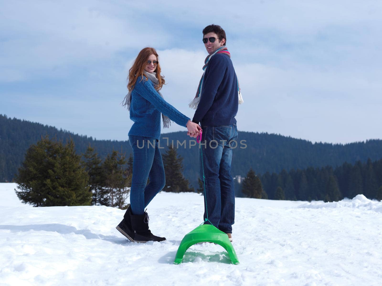 romantic winter  scene, happy young couple having fun on fresh show on winter vacatio, mountain nature landscape