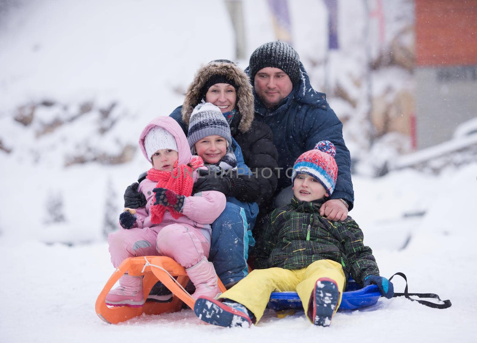 group of children having fun and play together in fresh snow on winter vacation