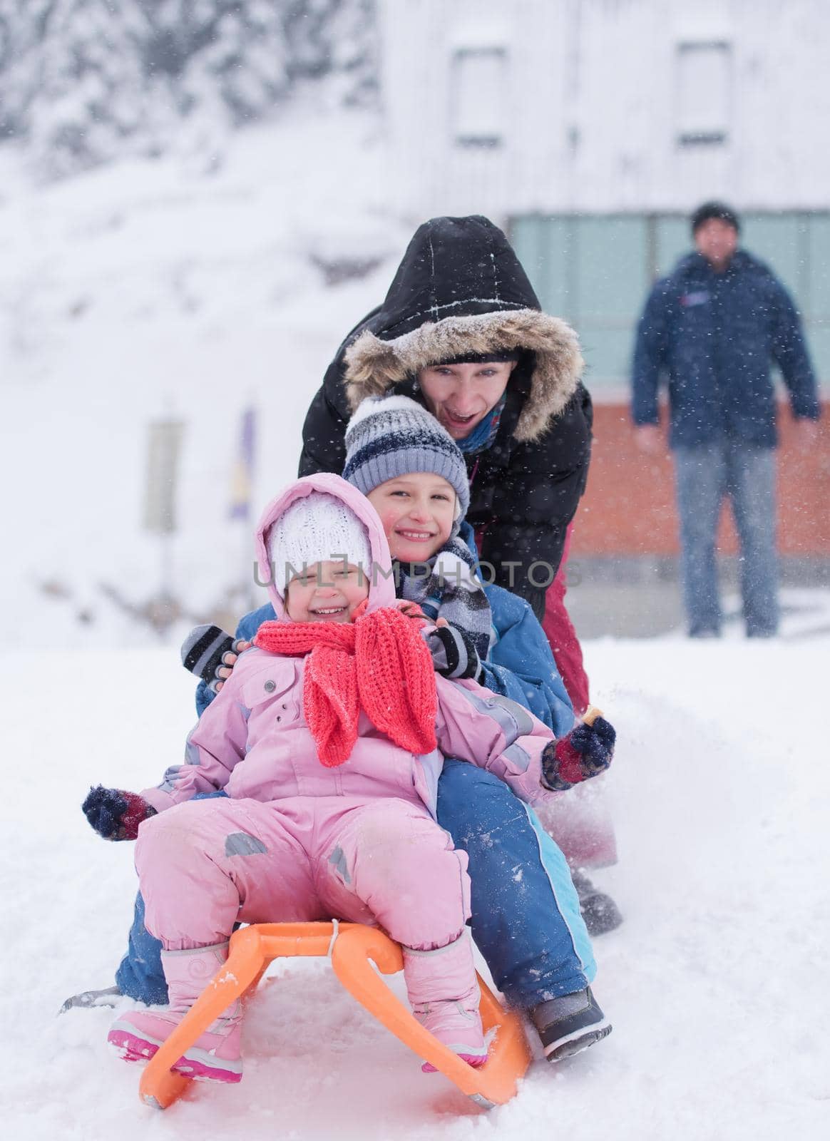 group of children having fun and play together in fresh snow on winter vacation