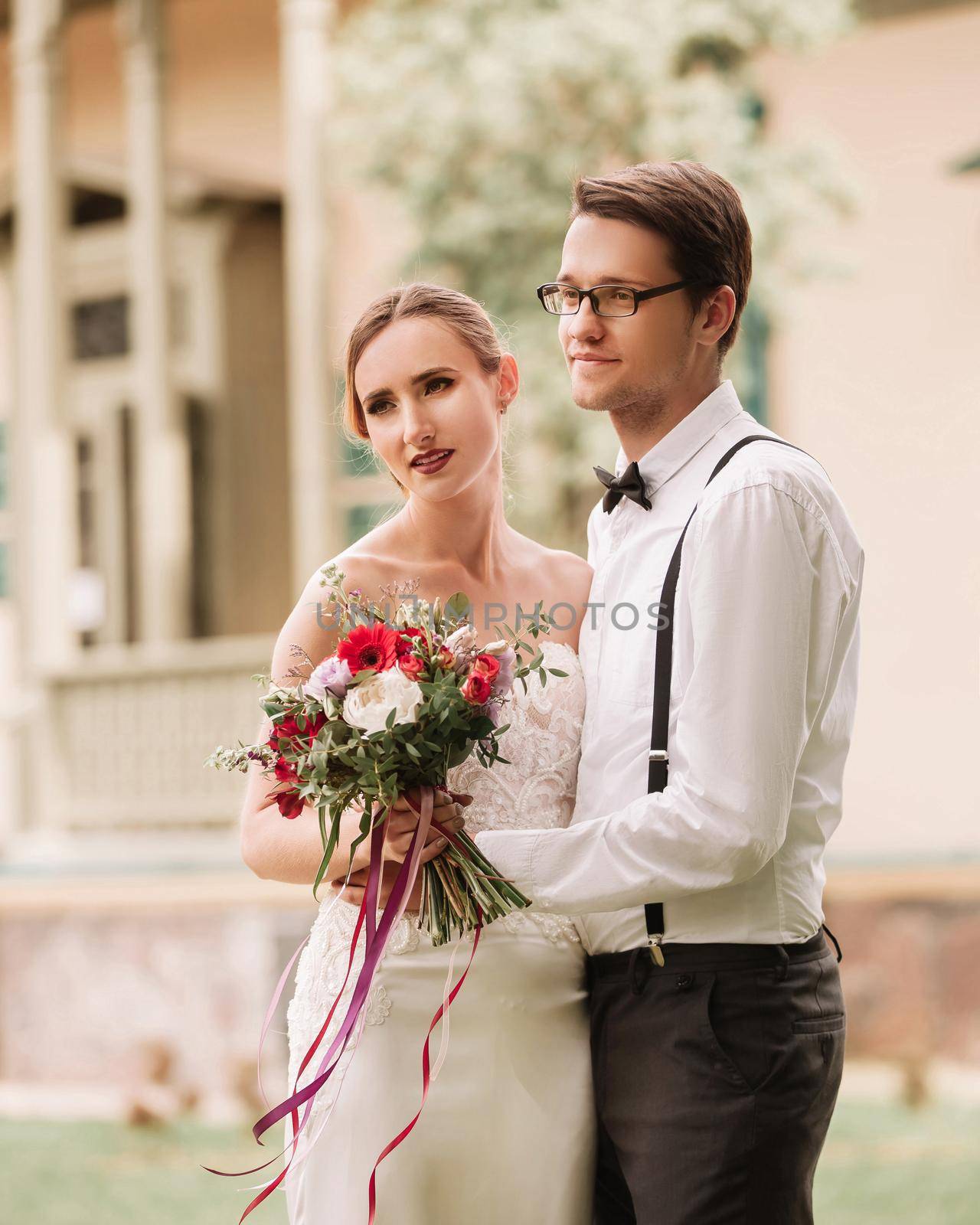 close up.happy newlyweds on the background of their new home