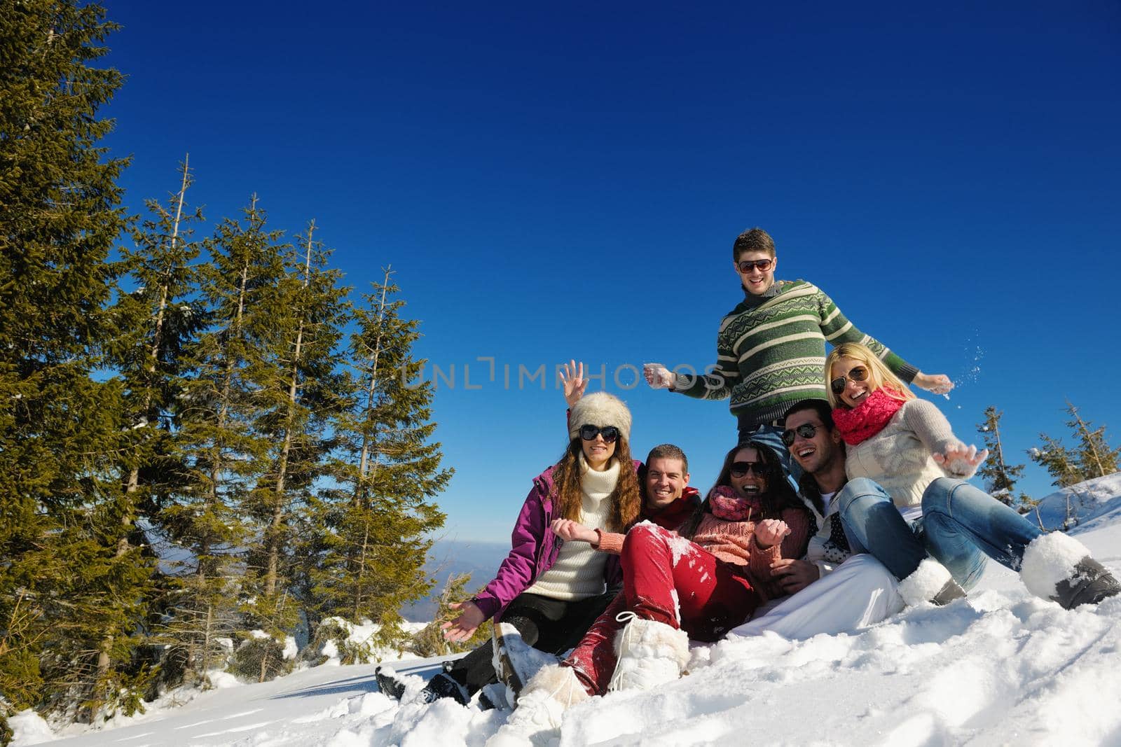 Young Couple In winter Snow Scene at  beautiful sunny day