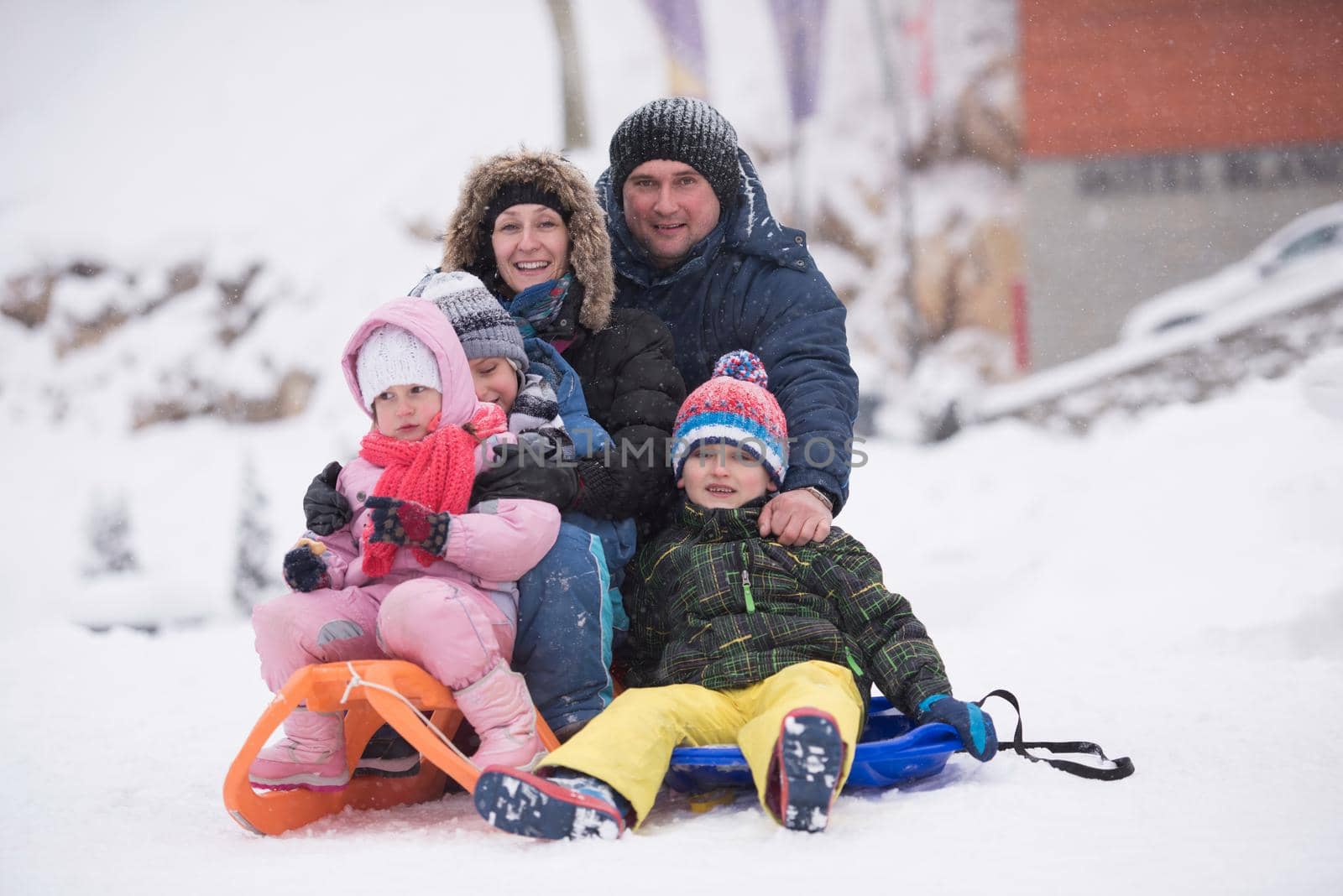 group of children having fun and play together in fresh snow on winter vacation