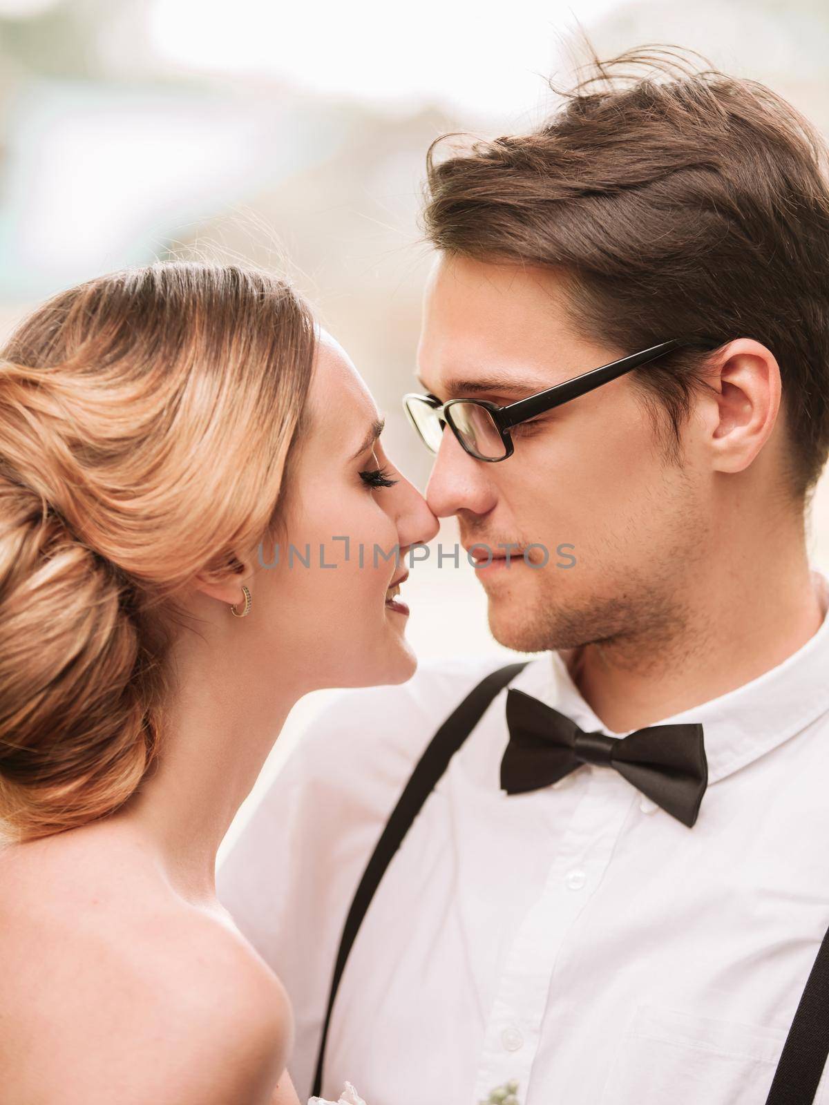 happy newlyweds on the background of their new home by SmartPhotoLab