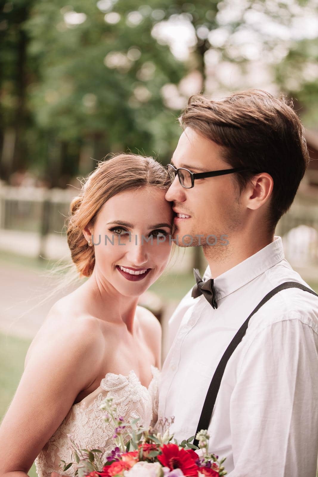 close up. portrait of happy newlyweds on blurred background.