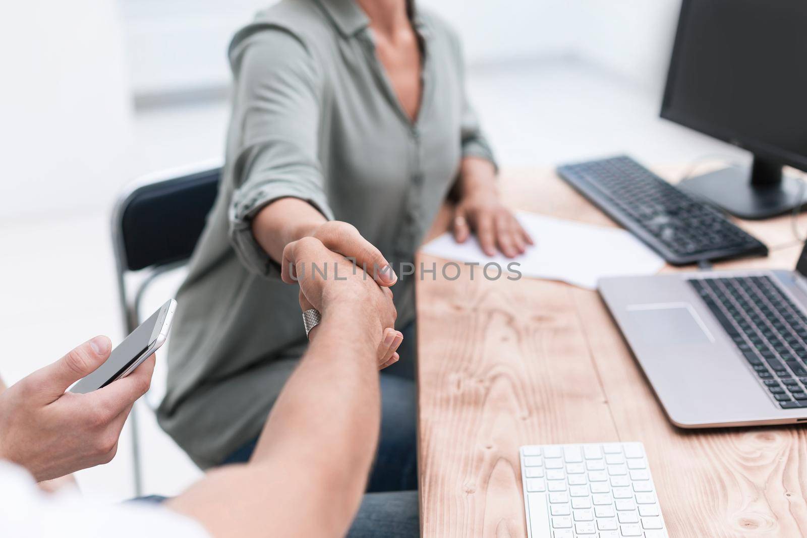 close up. handshake Manager and client during the meeting. photo with space for text