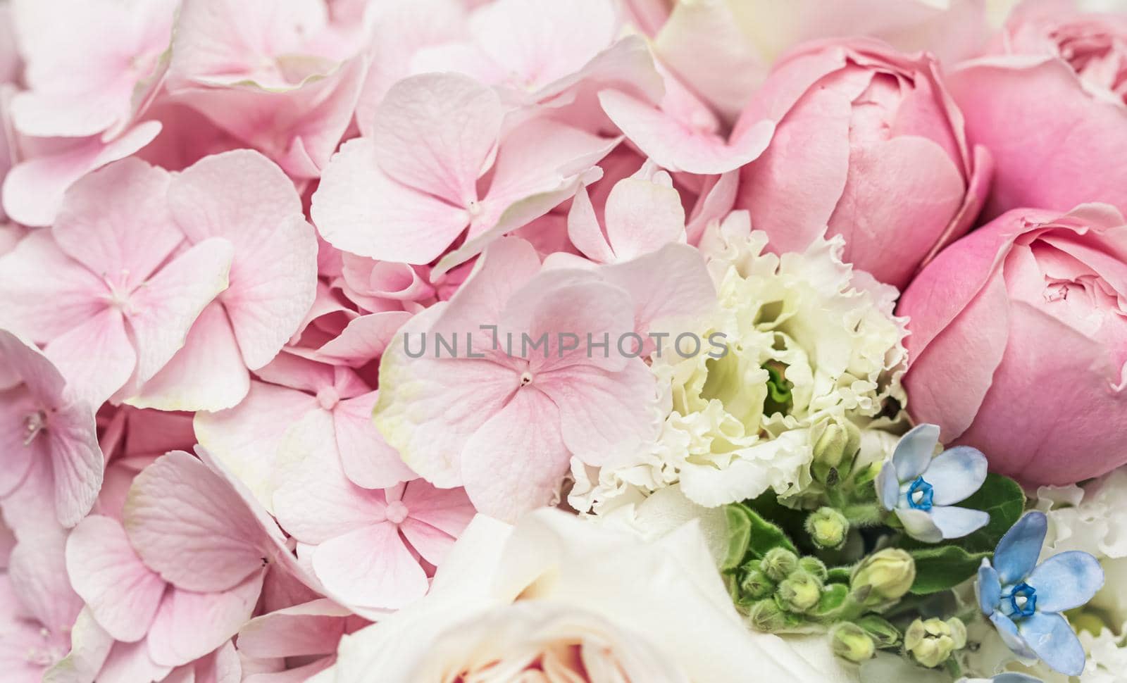 Beautiful flower bouquet arrangement close up in pastel colors. Decoration of roses and decorative plants, selective focus