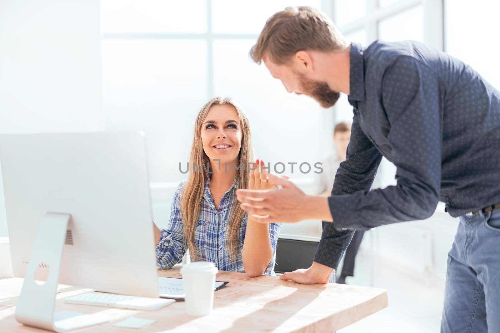 young employees discussing online news in the office . office weekdays