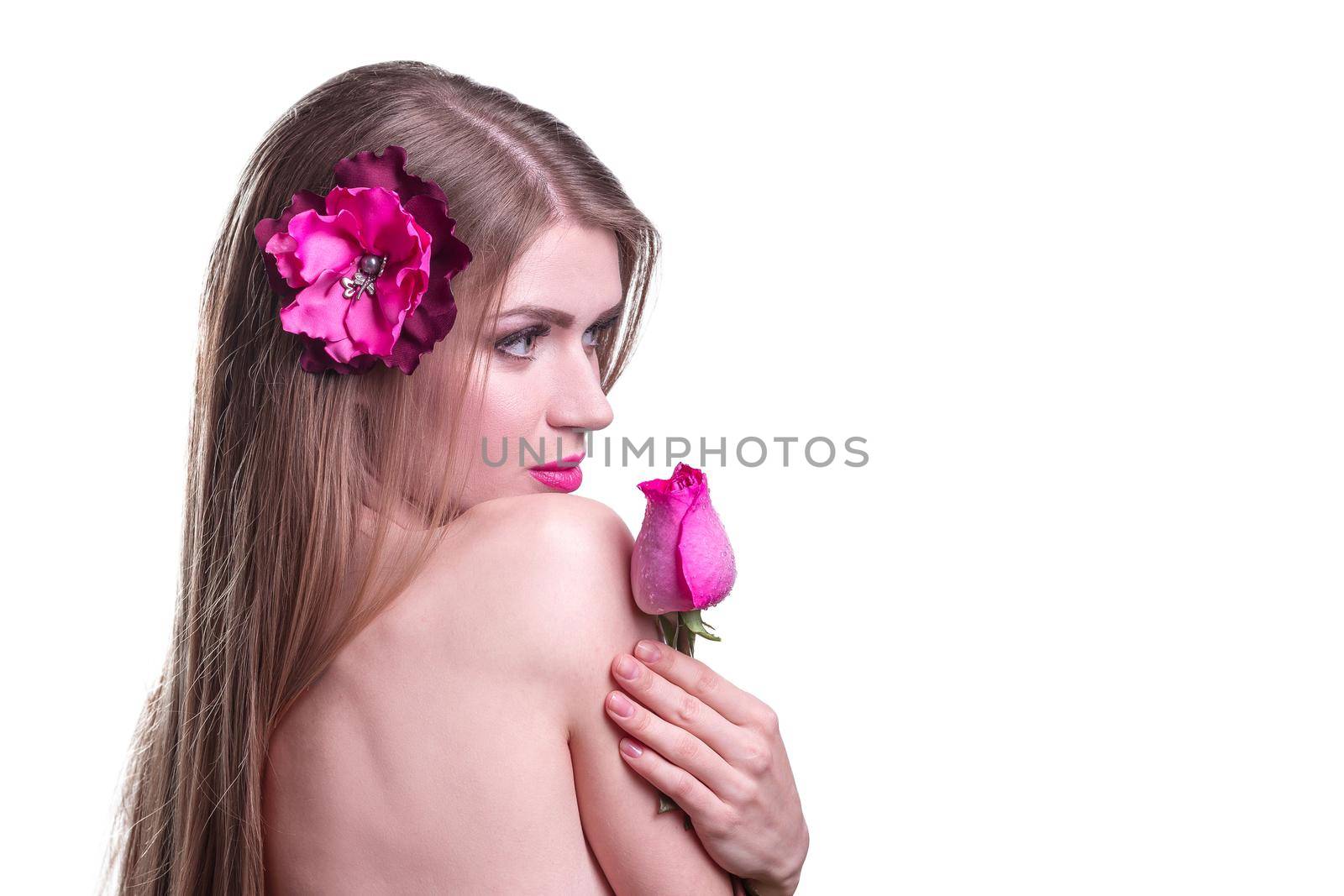side view. portrait of a young woman with a rose in evening dress.isolated on light background