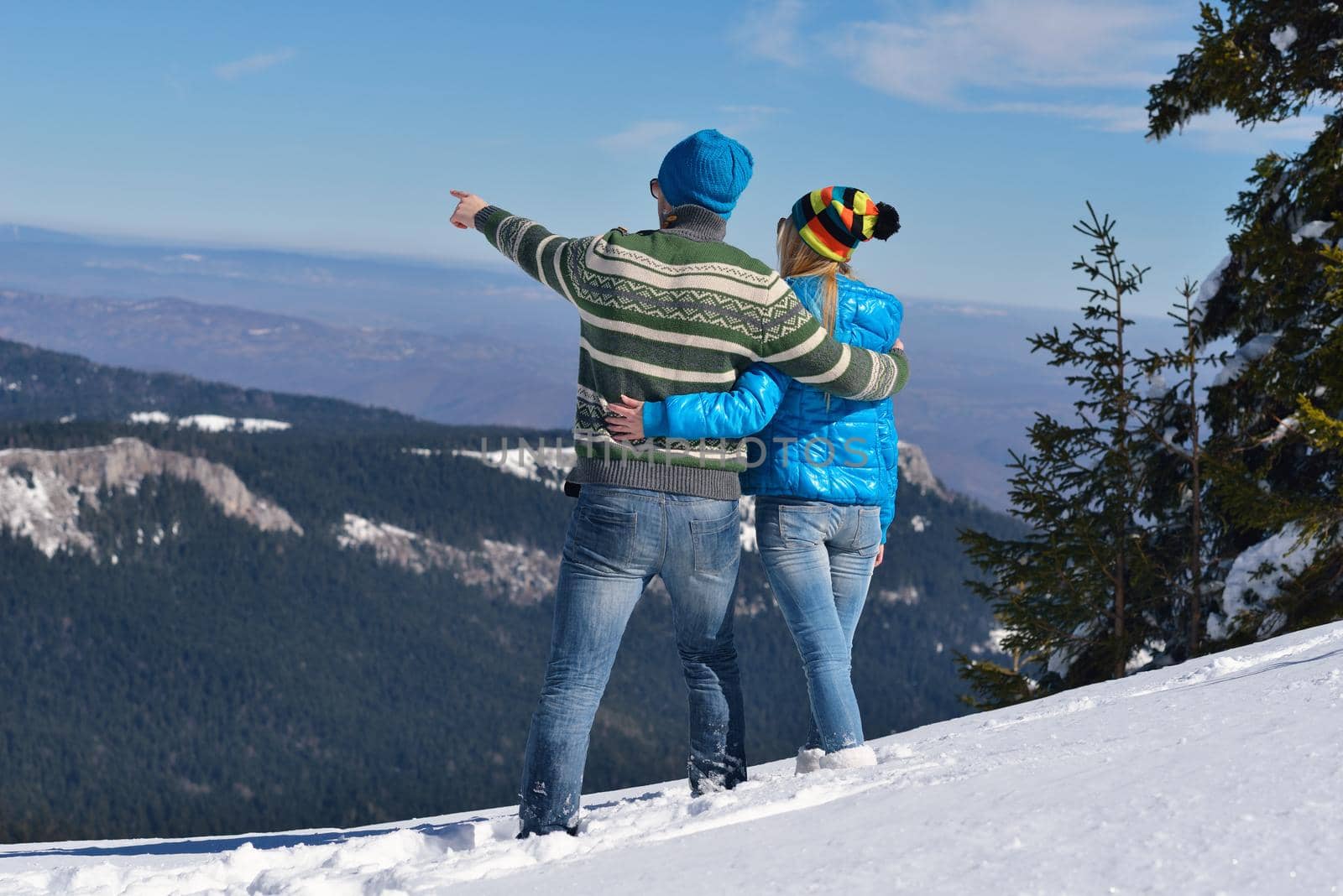 young couple on winter vacation by dotshock