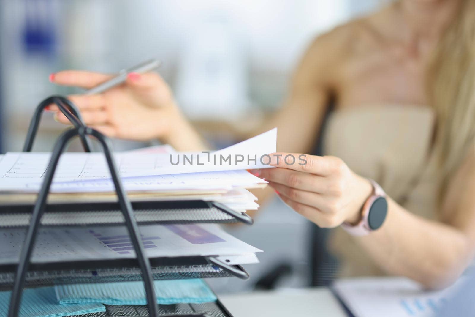 Close-up of female busy with papers on workplace, documents and problem projects, day in hurry. Clever company worker in office. Business, success concept