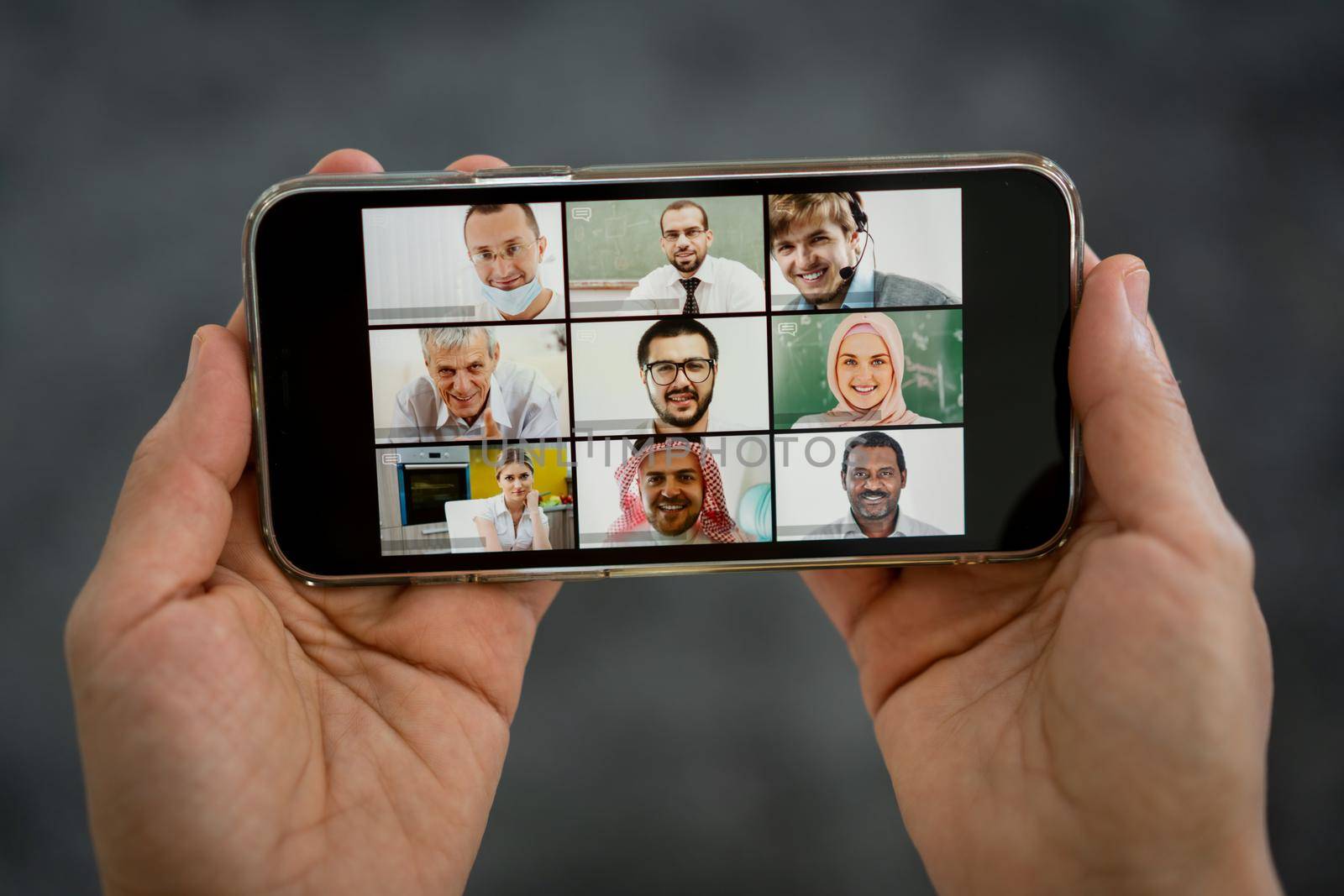 Online business conference smartphone in hands by Zurijeta