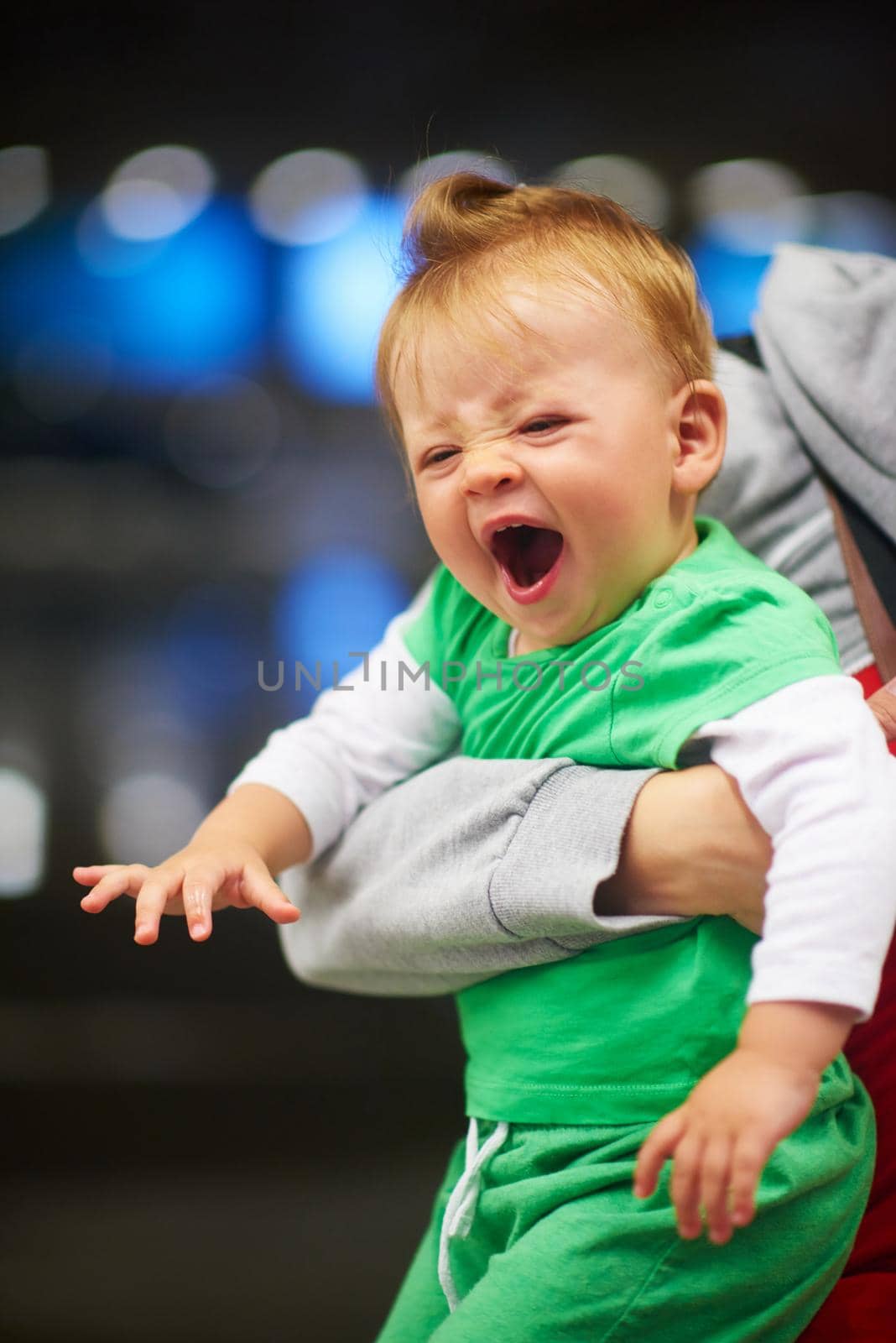 young mother with baby in shopping mall supermarket store buying food and grocery