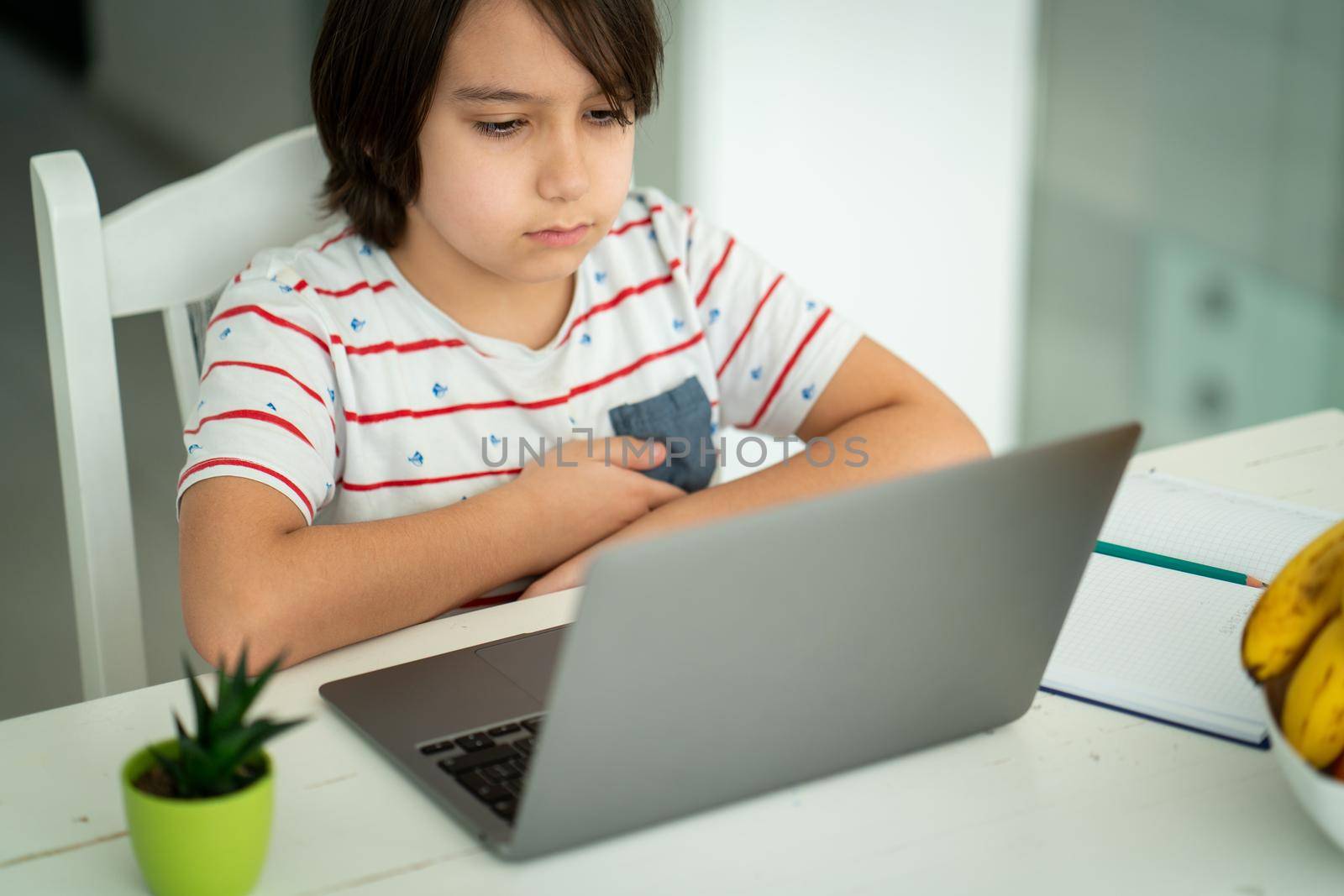 Child using laptop at home indoors. high quality photo
