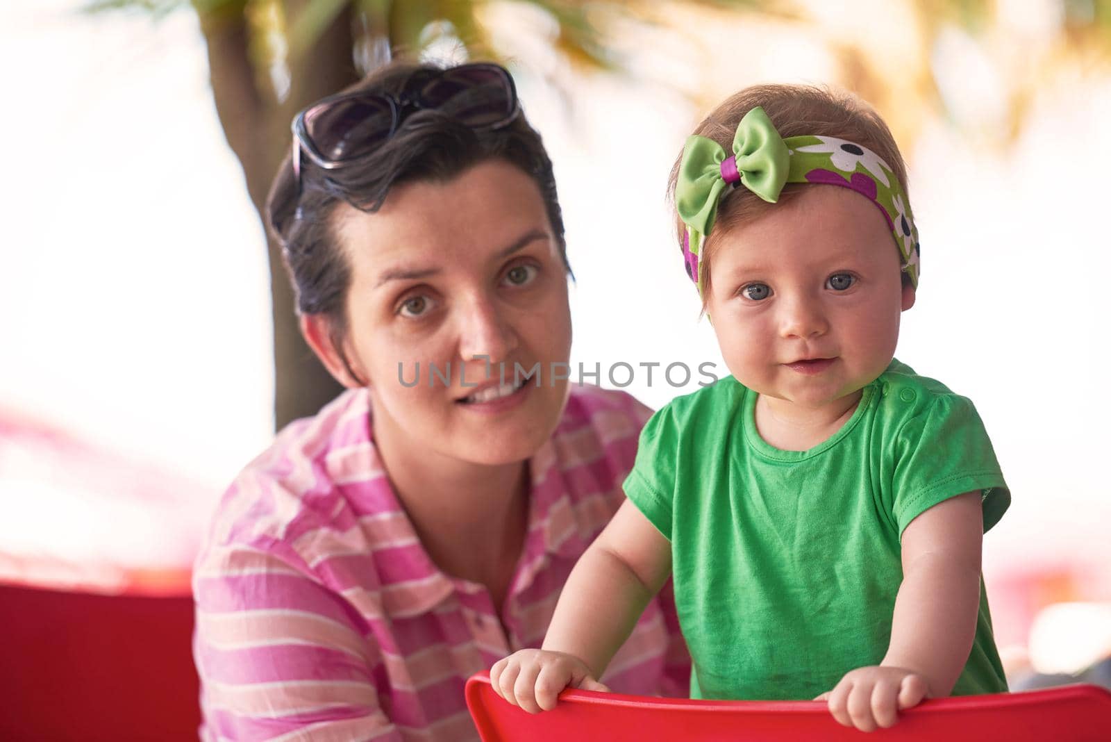 portrait of happy young mother and baby  while have  fun