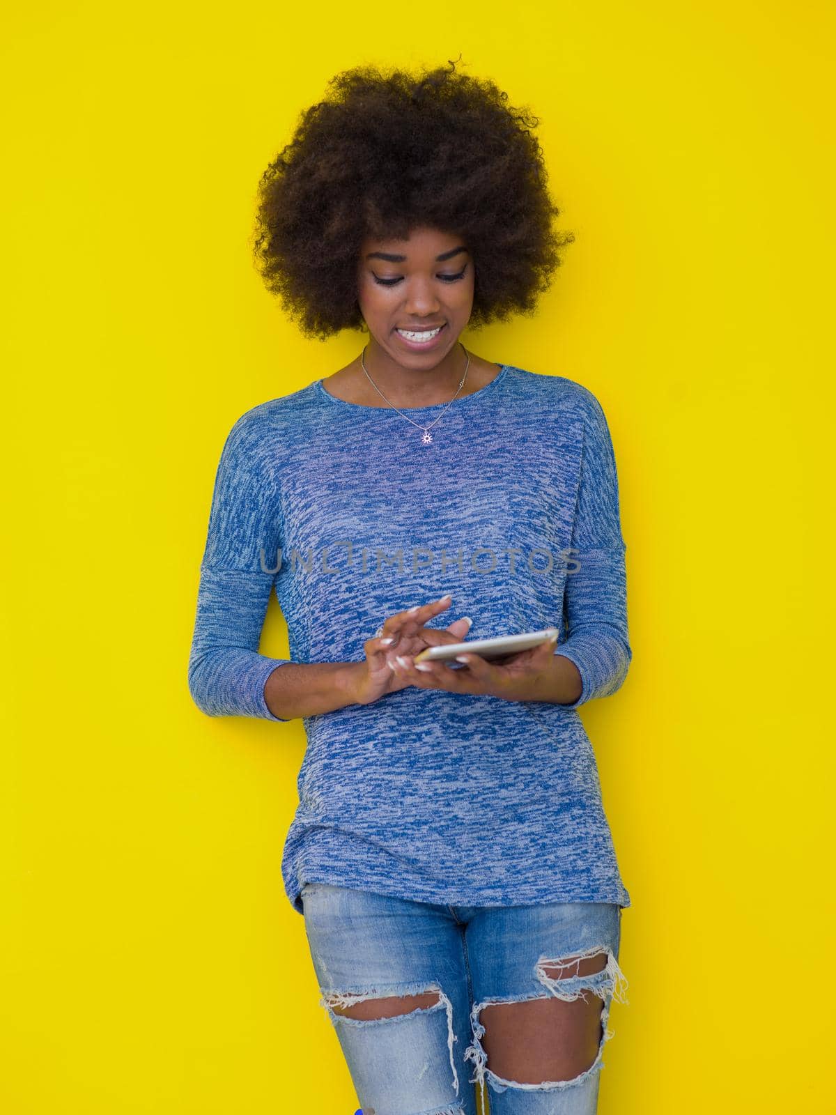 young black Woman Using Digital Tablet by dotshock