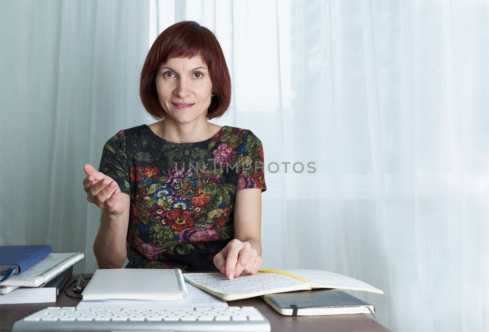 Distance education for students. Quarantine, self-isolation, sociophobia. Tutor conducts classes over Internet online lectures. Woman look at laptop.