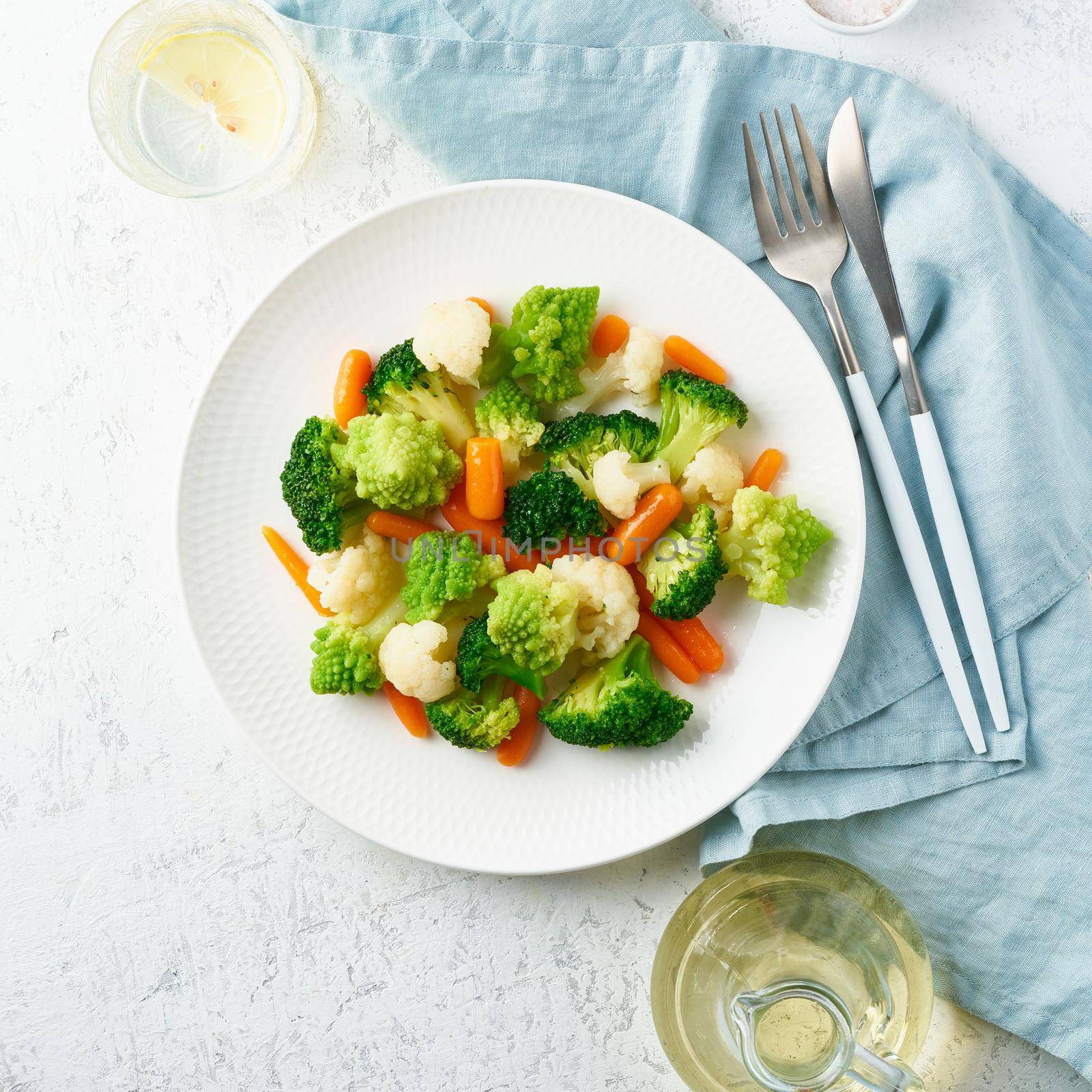 Mix of boiled vegetables. Broccoli, carrots, cauliflower. Steamed vegetables for dietary low-calorie diet. FODMAP, dash diet, vegan, vegetarian, top view
