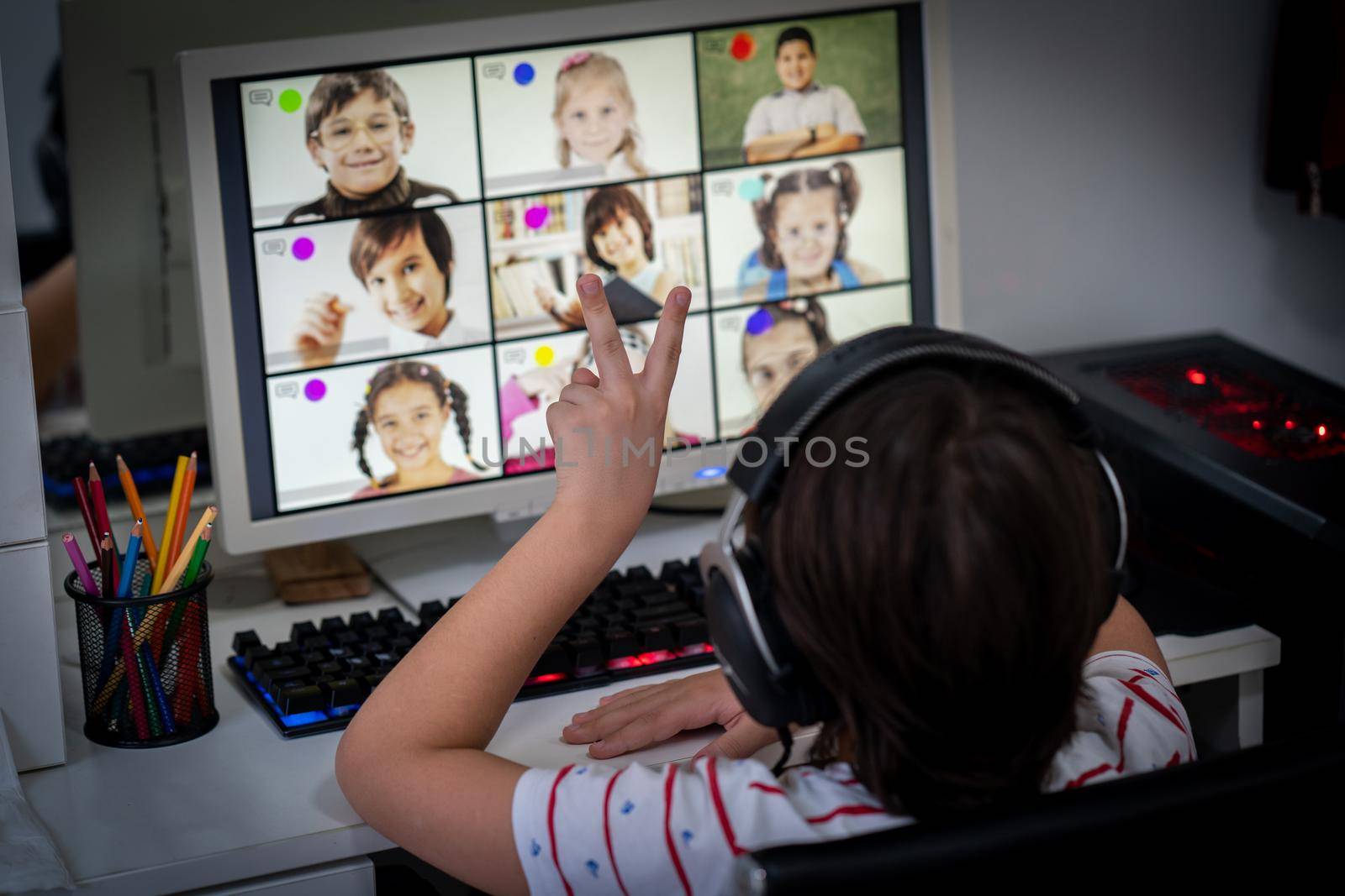 Little boy having online school distance learning class at home by Zurijeta