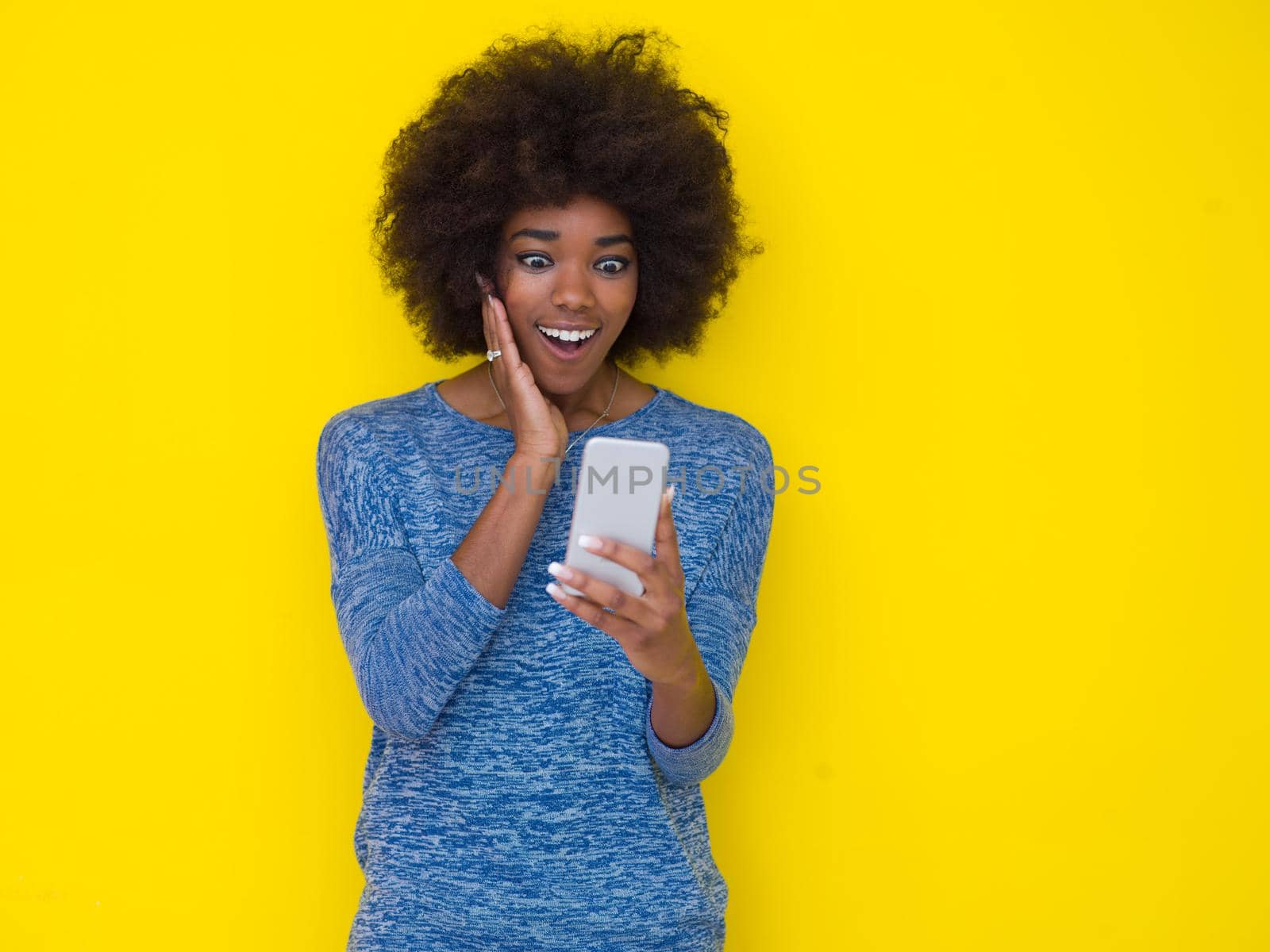 young black Woman Using mobile phone by dotshock