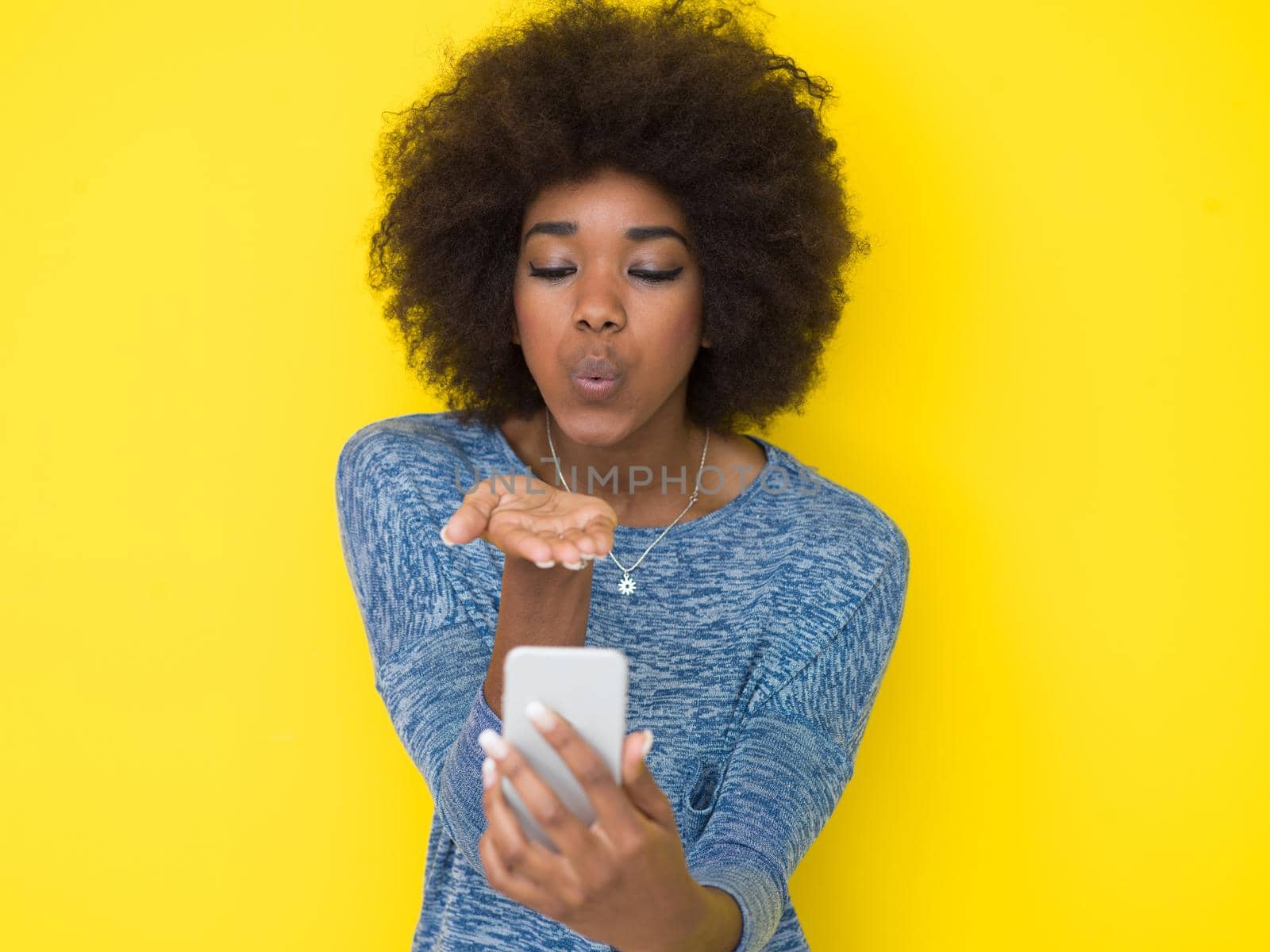 young black Woman Using mobile phone by dotshock