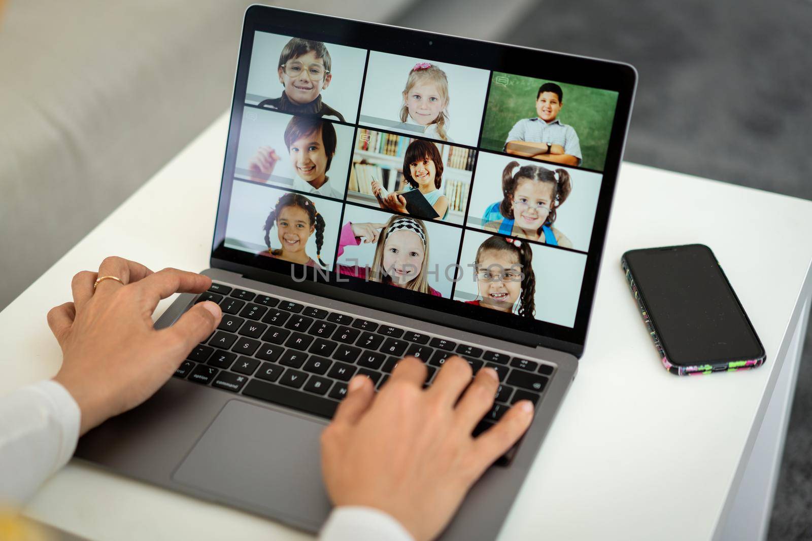 Arabic female teacher working with children online school during pandemic