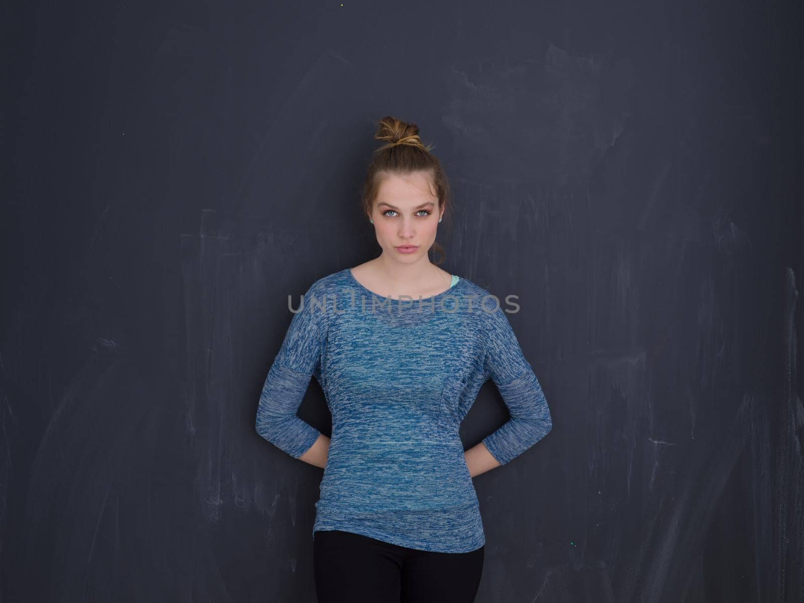 portrait of Beautiful young woman isolated on grey background