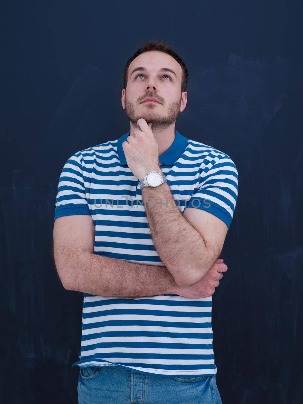 portrait of a handsome young man isolated over a gray background