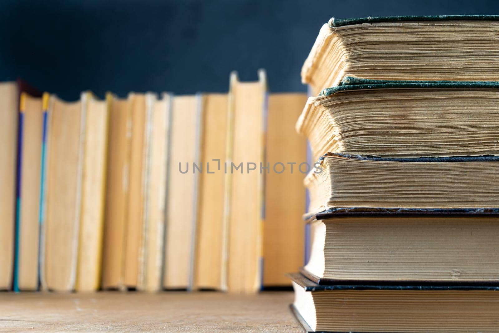 Book background. Old books in the library. Bookshelf shop. Knowledge publications, literature. Bookish bookstore, bookshop. Flatlay top view.