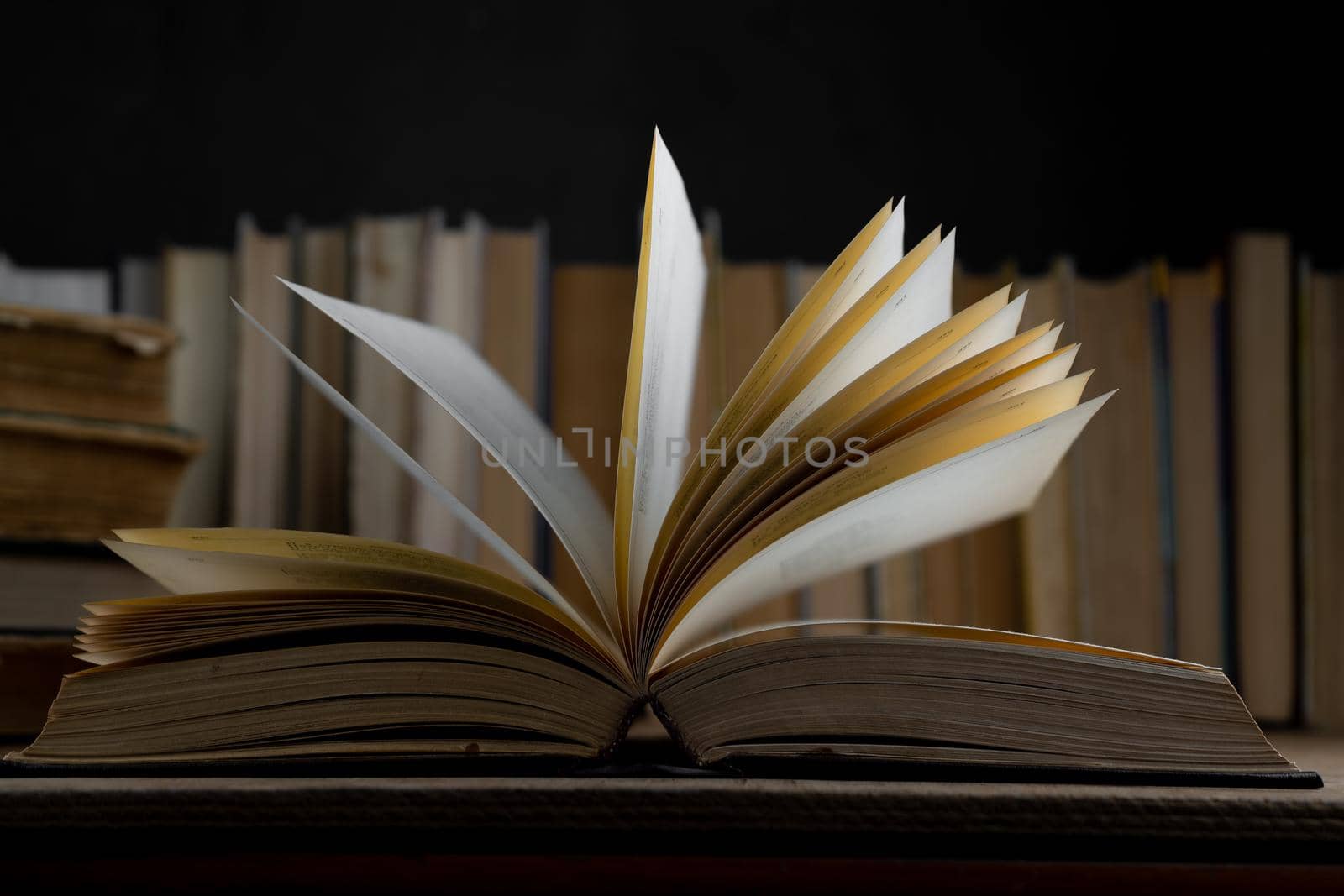 Book background. Old books in the library. Bookshelf shop. Knowledge publications, literature. Bookish bookstore, bookshop. Flatlay top view.